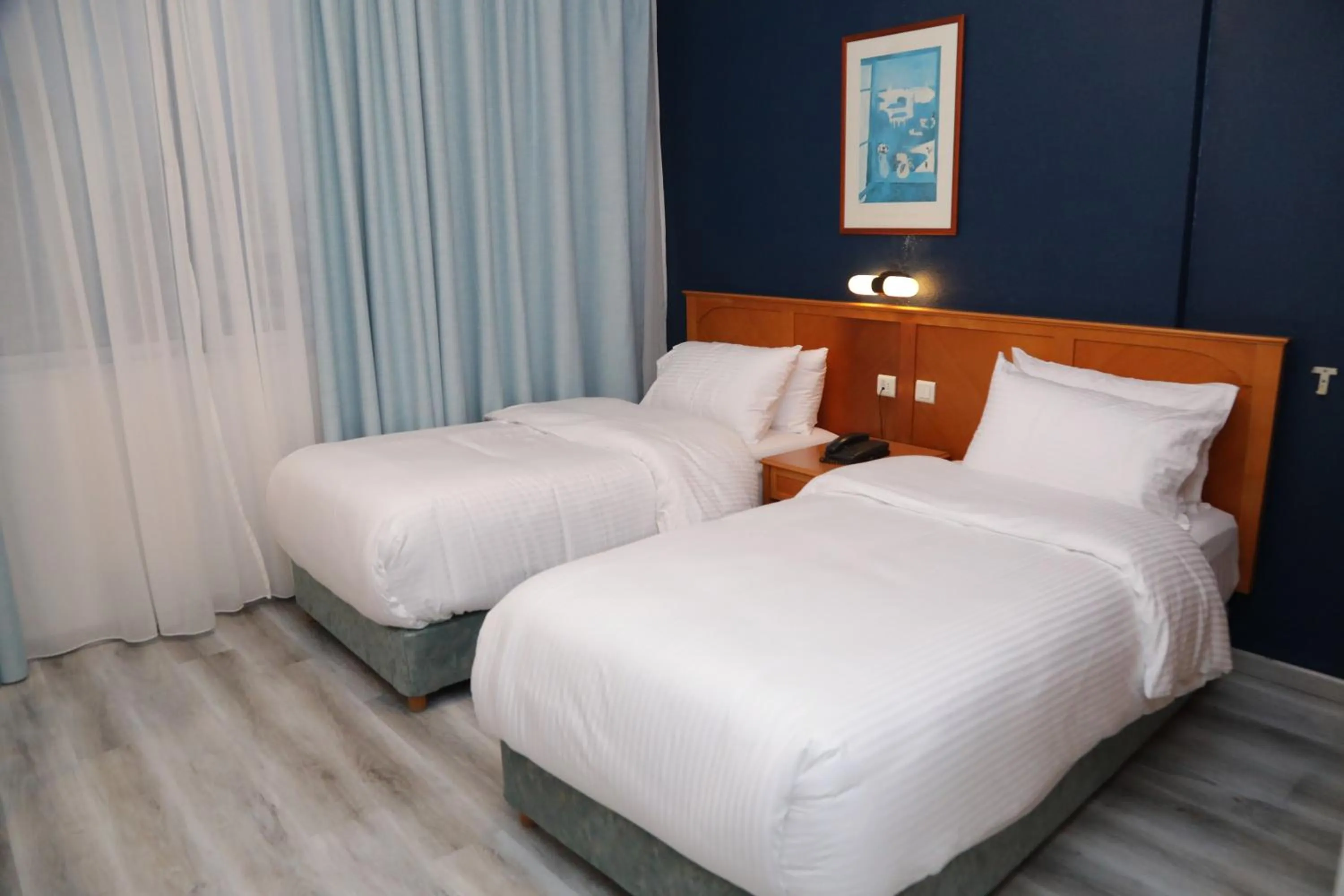 Bed in El Sheikh Suites Hotel