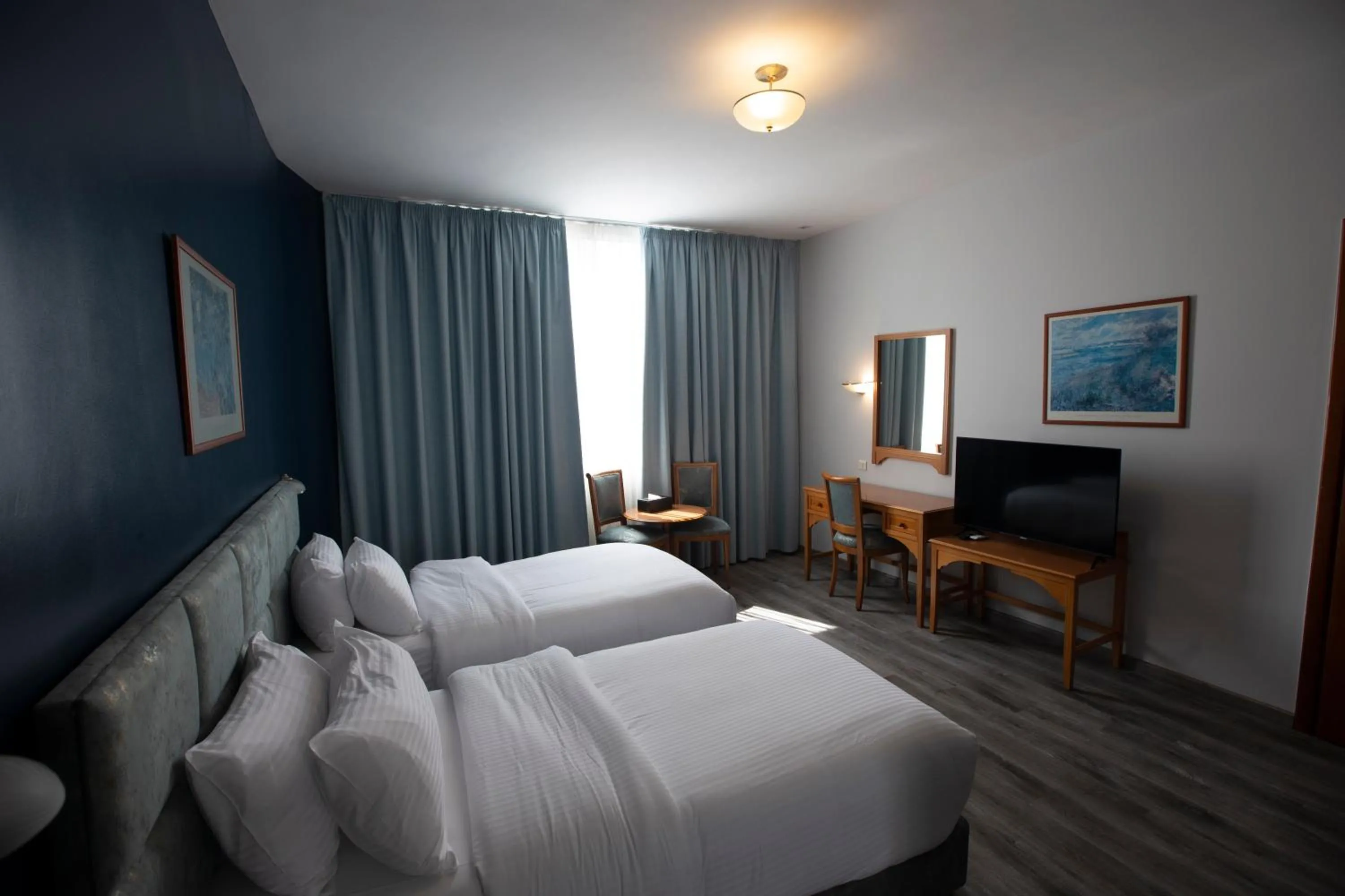 Bed in El Sheikh Suites Hotel