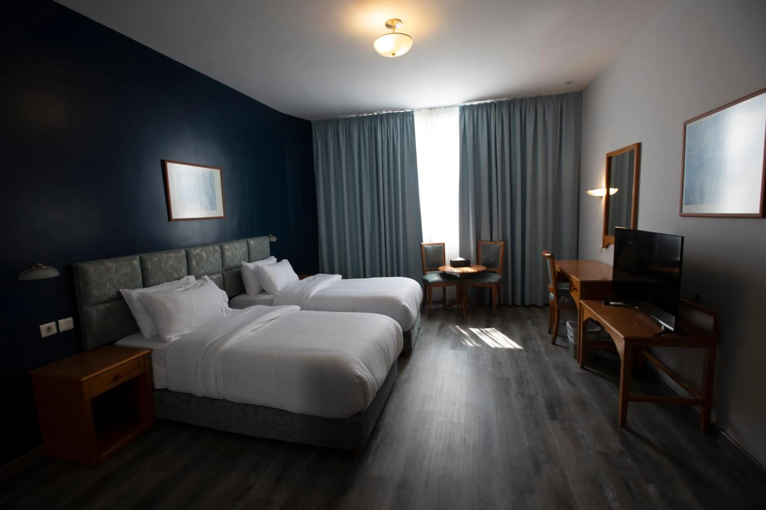 Bed in El Sheikh Suites Hotel