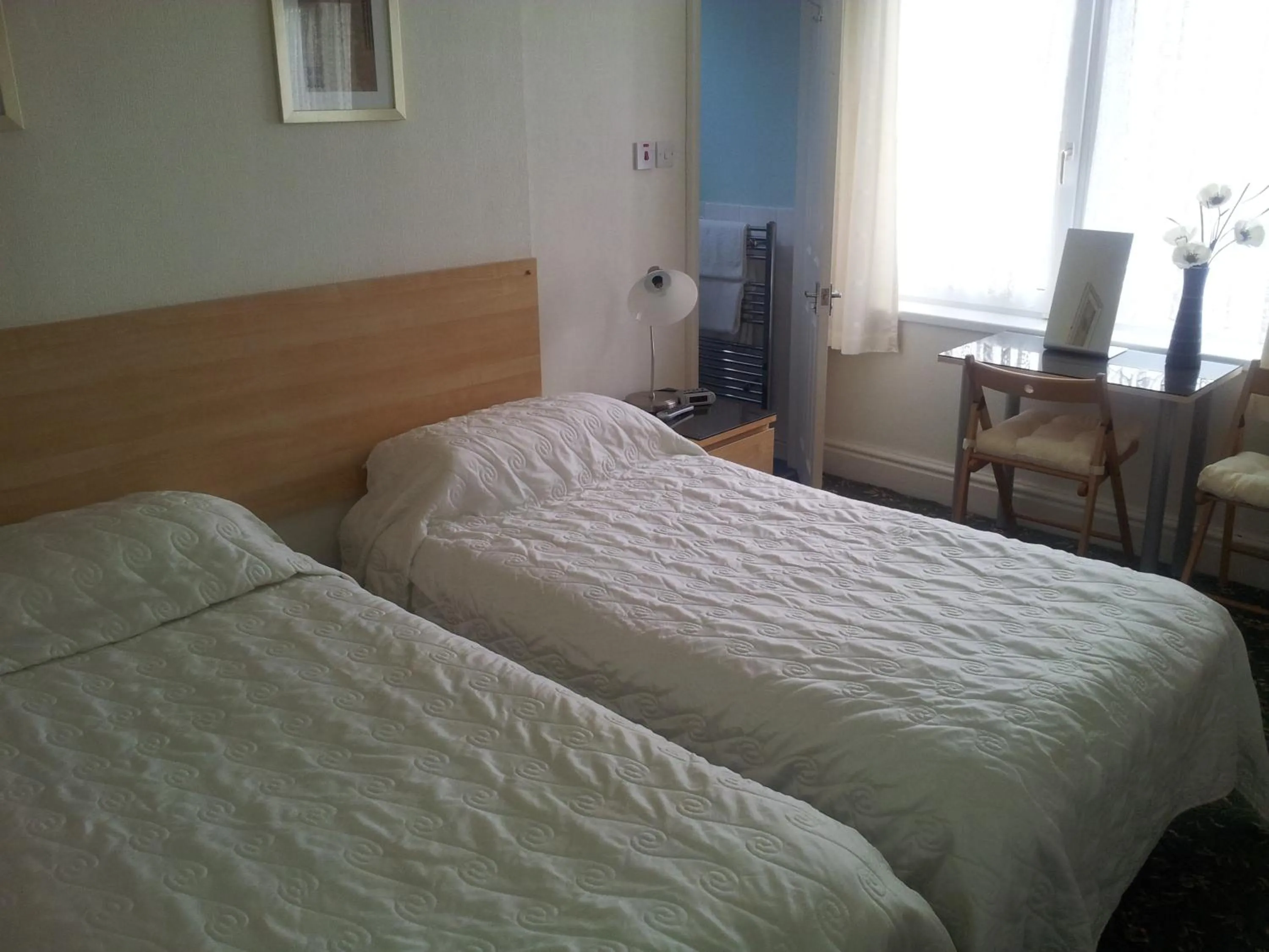 Bed in Beachcomber Hotel