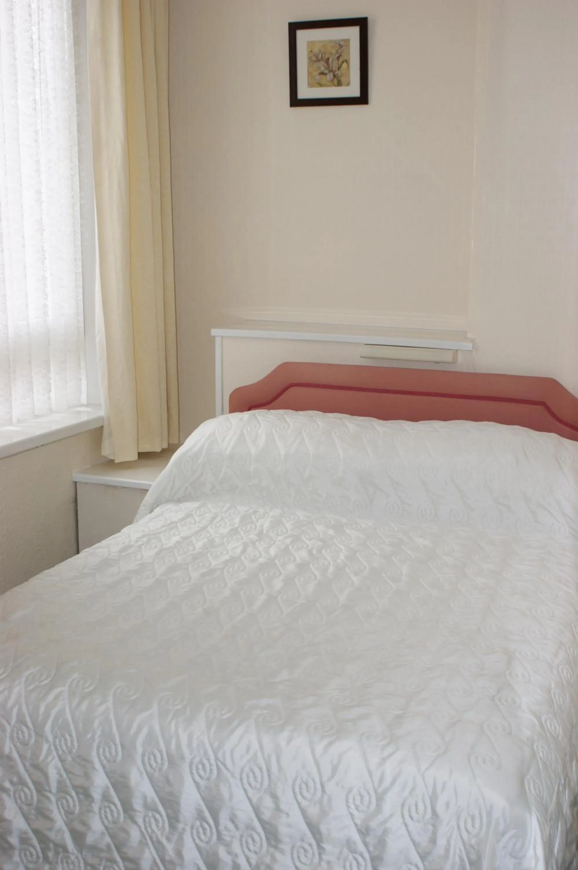 Bed in Beachcomber Hotel