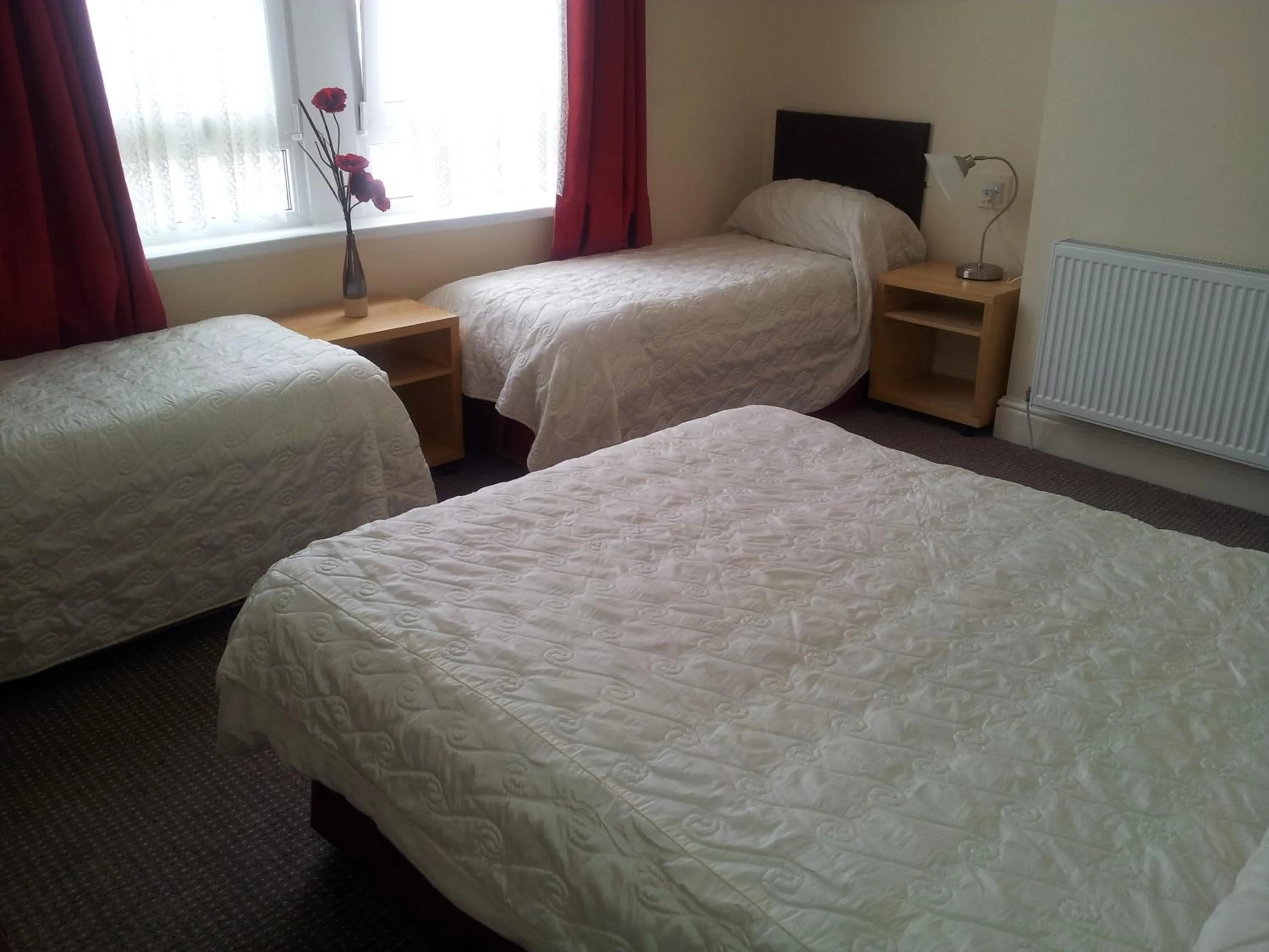 Bed in Beachcomber Hotel