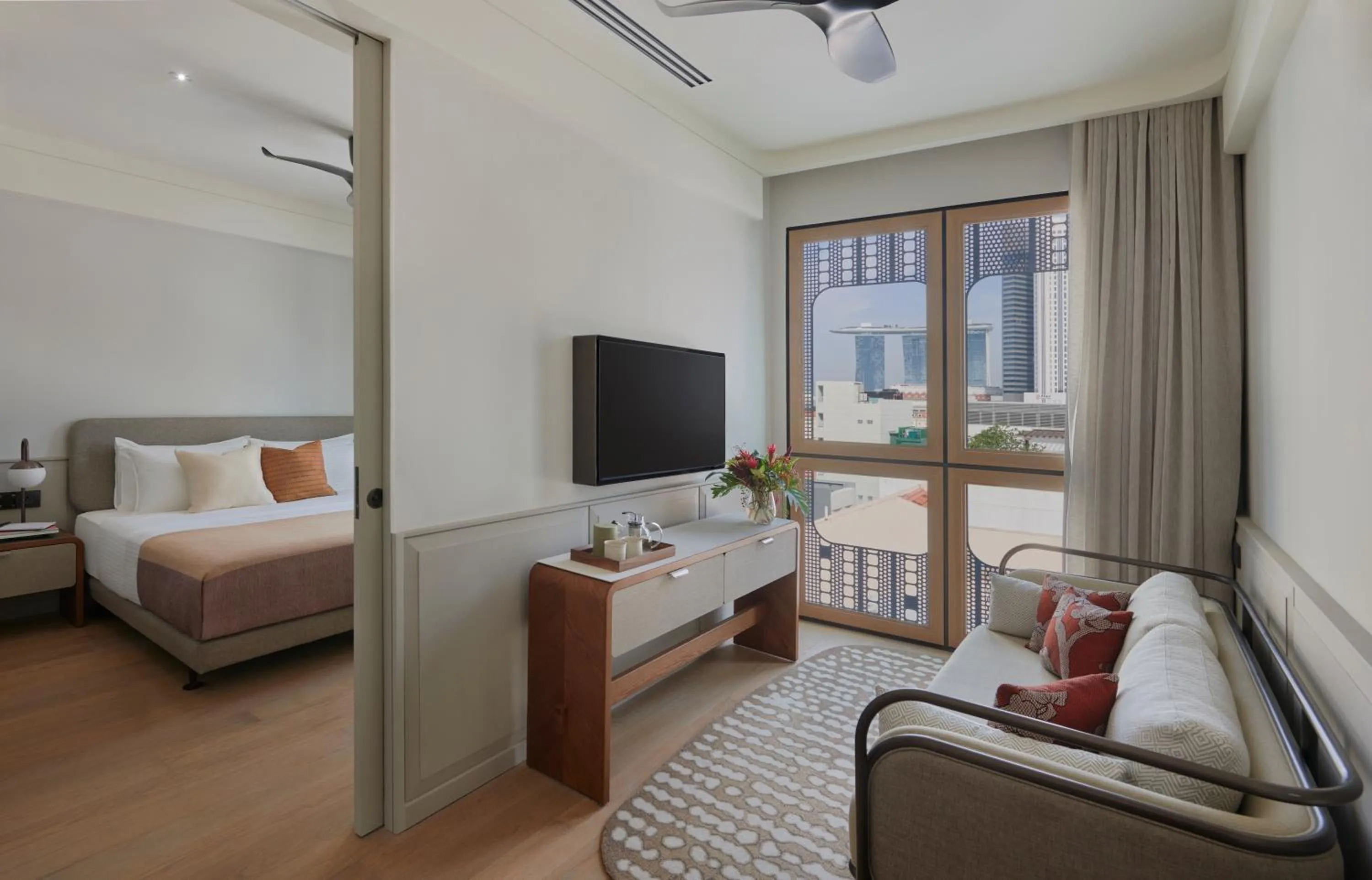 Living room, Bed in 21 Carpenter, Singapore, a Member of Design Hotels