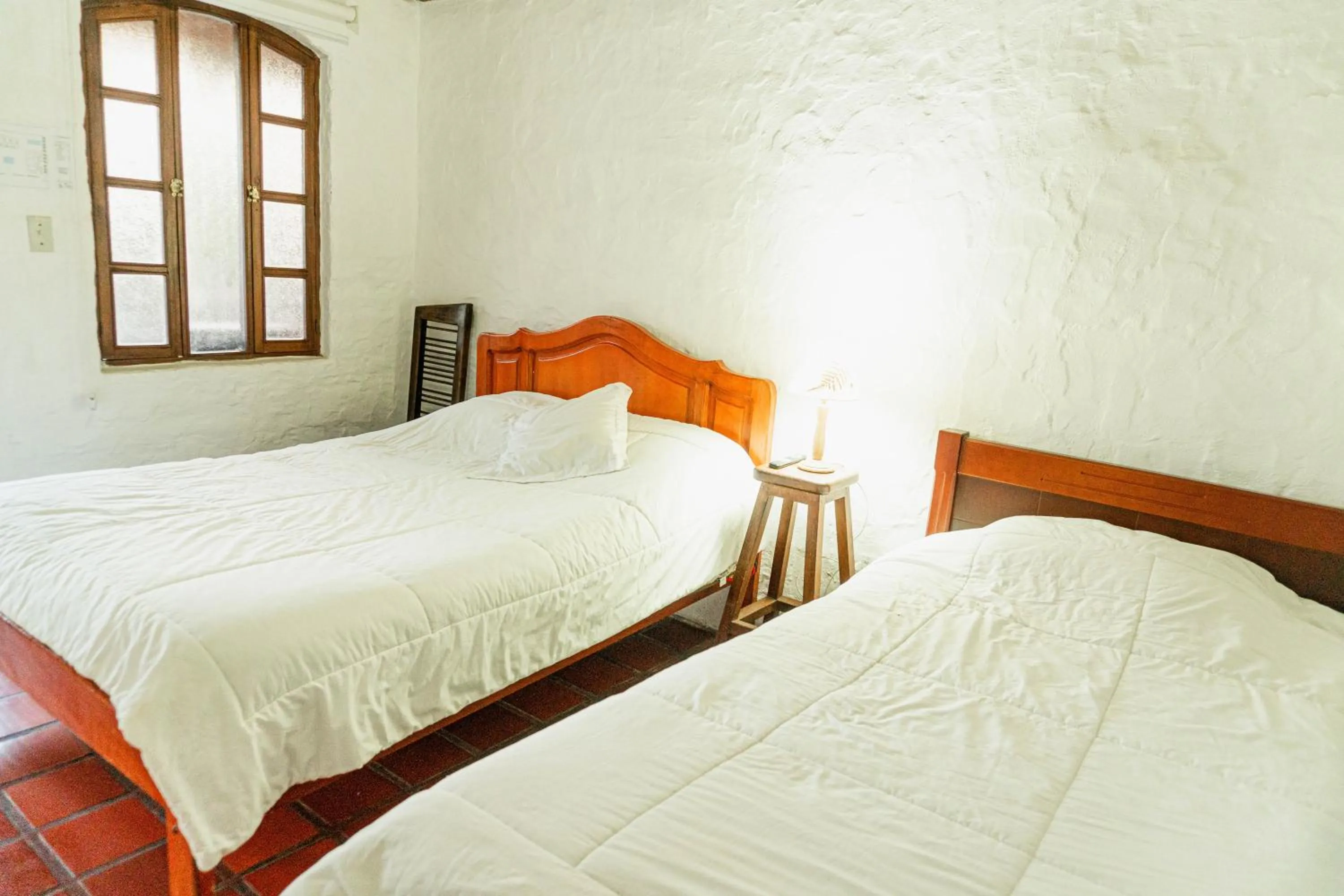 Bed in Hostería Colibri Aeropuerto