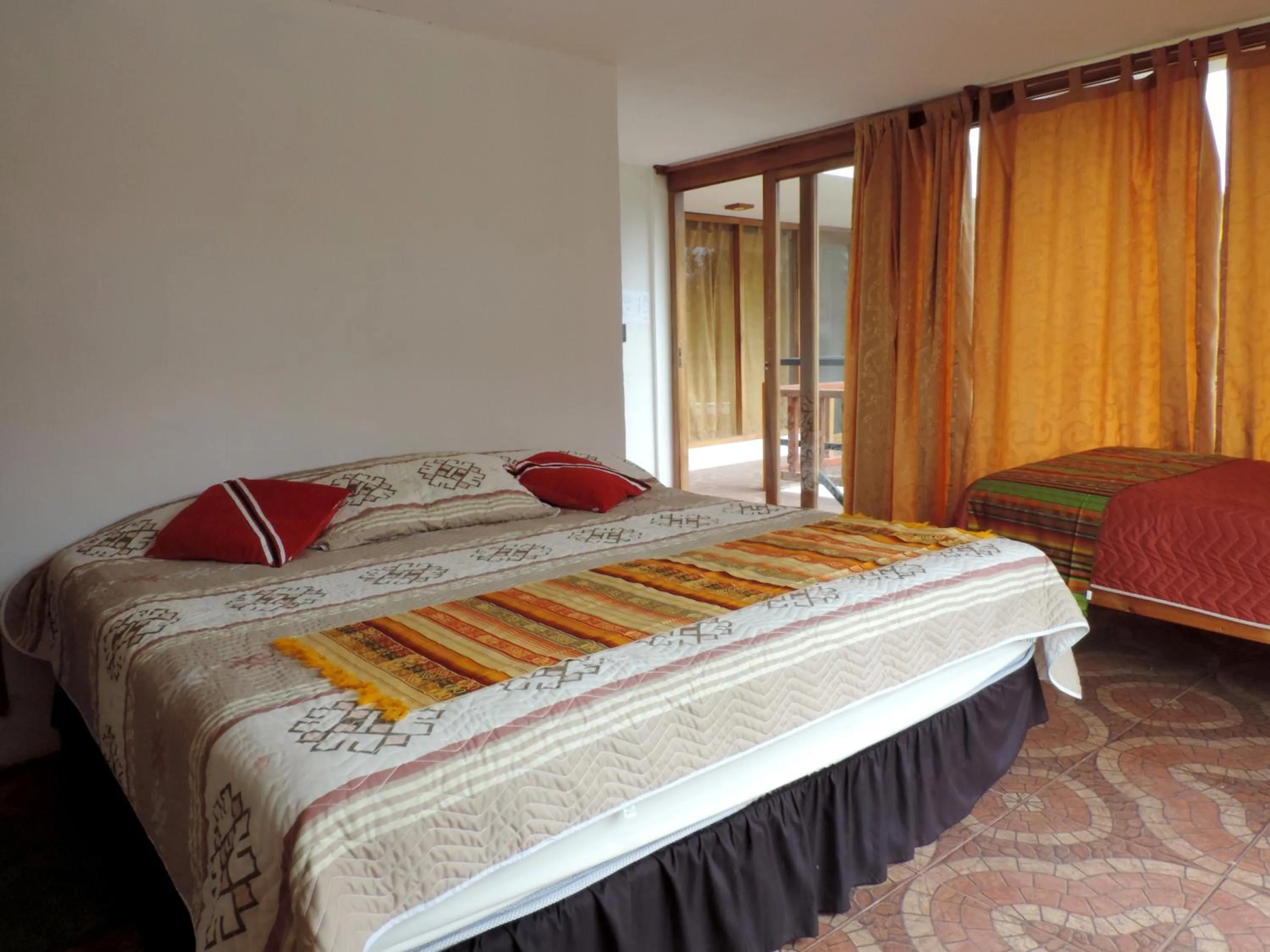 Bed in Hostería Colibri Aeropuerto