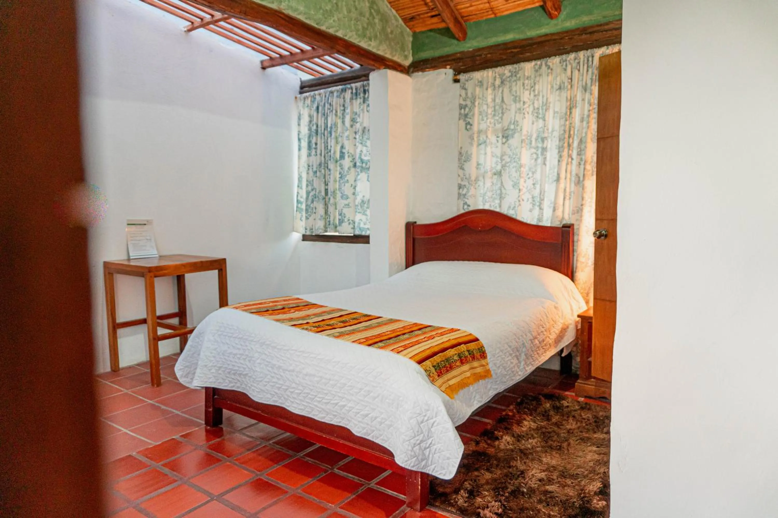 Bed in Hostería Colibri Aeropuerto