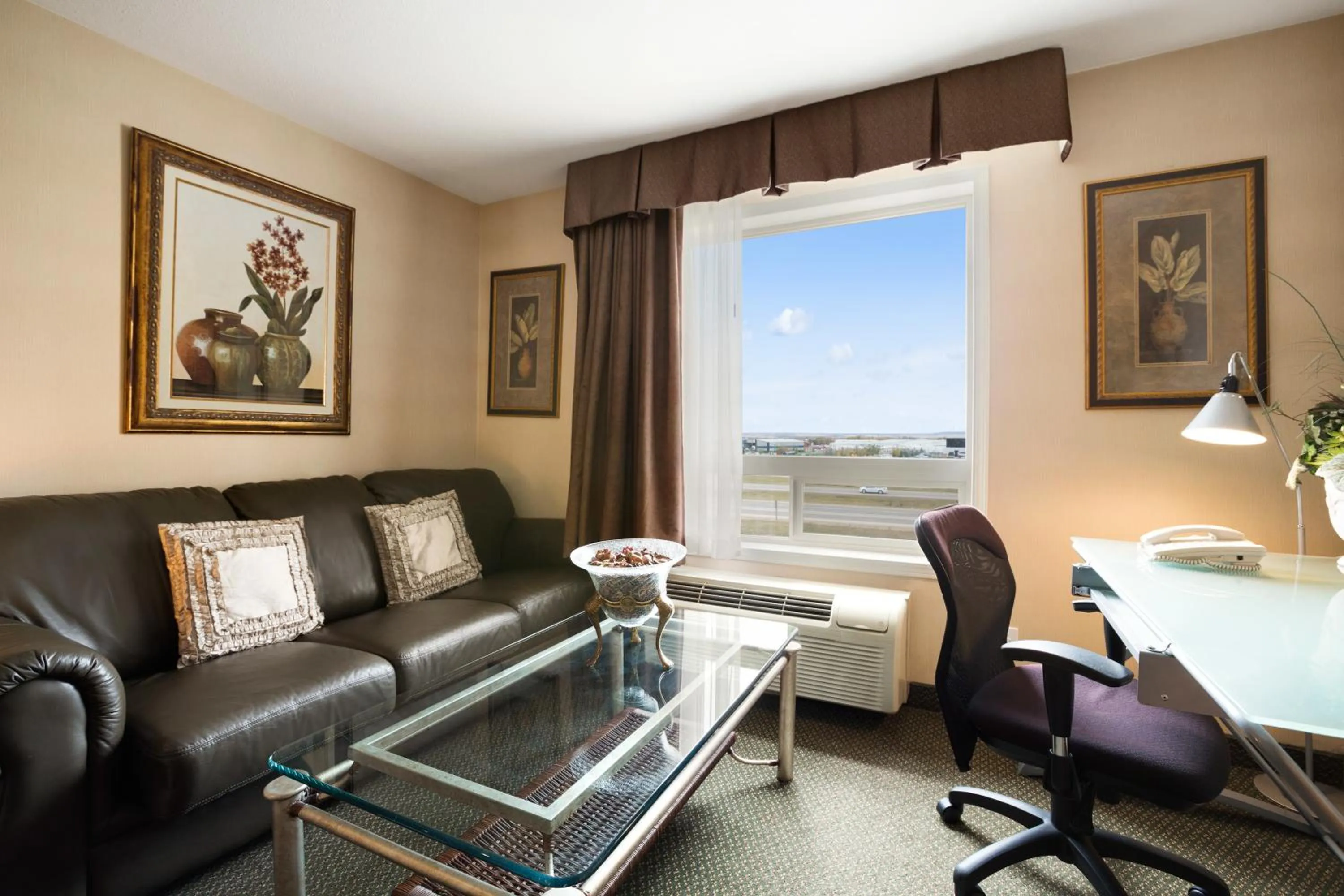 Living room in Ramada by Wyndham Clairmont/Grande Prairie
