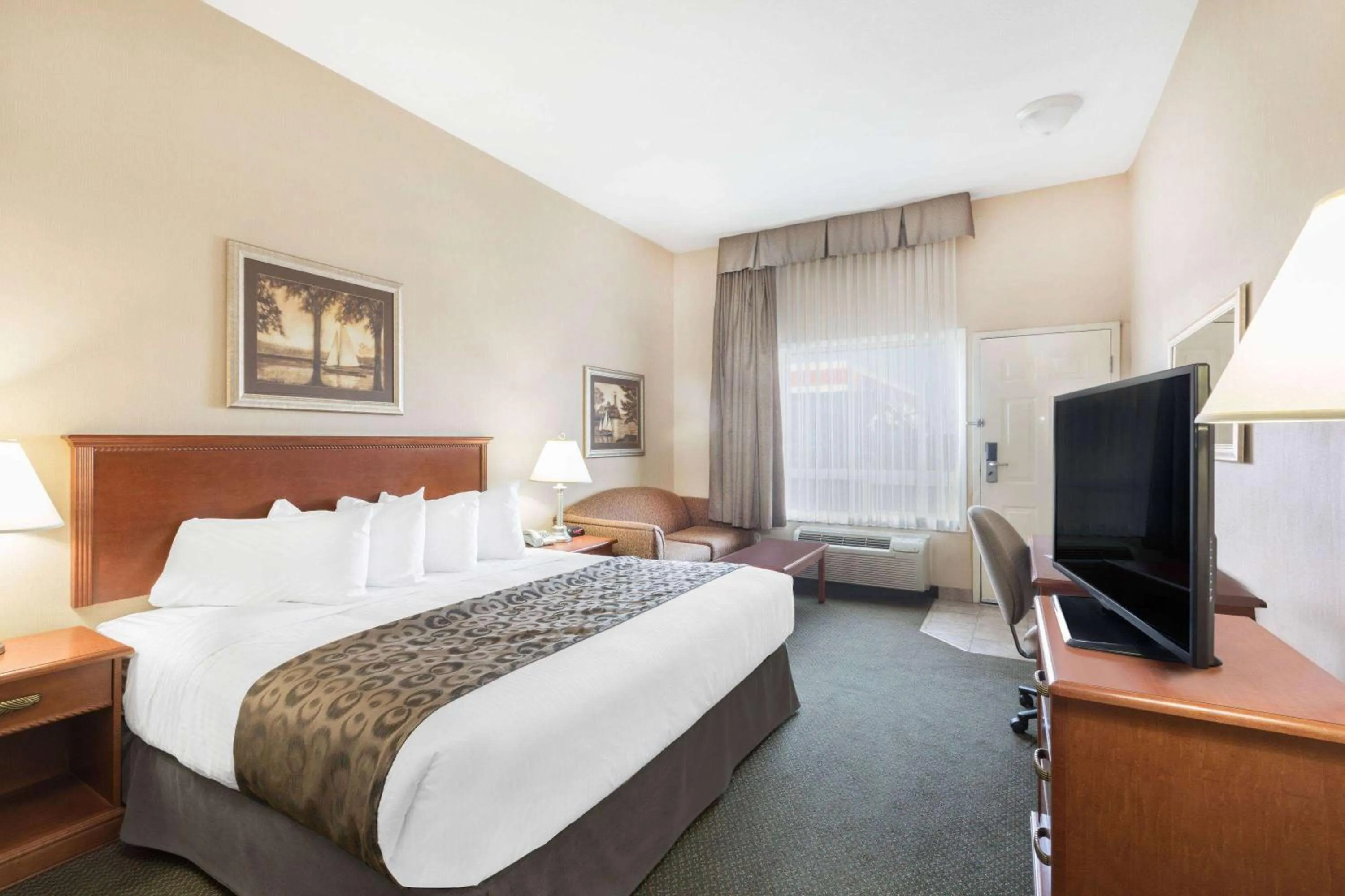 Photo of the whole room, Bed in Ramada by Wyndham Clairmont/Grande Prairie
