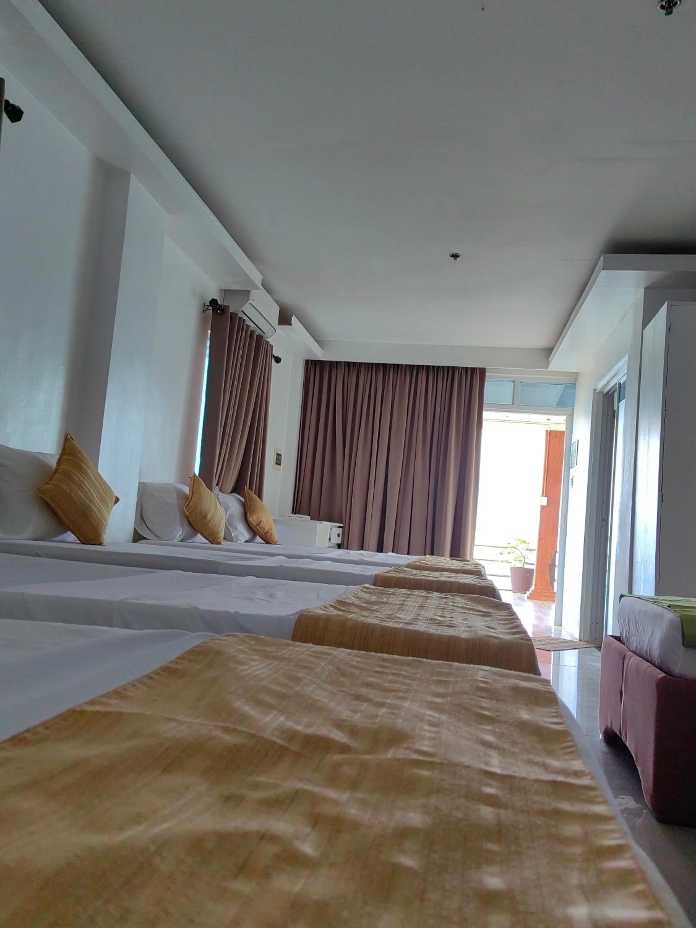 Bed in Orange Pearl Beach Resort