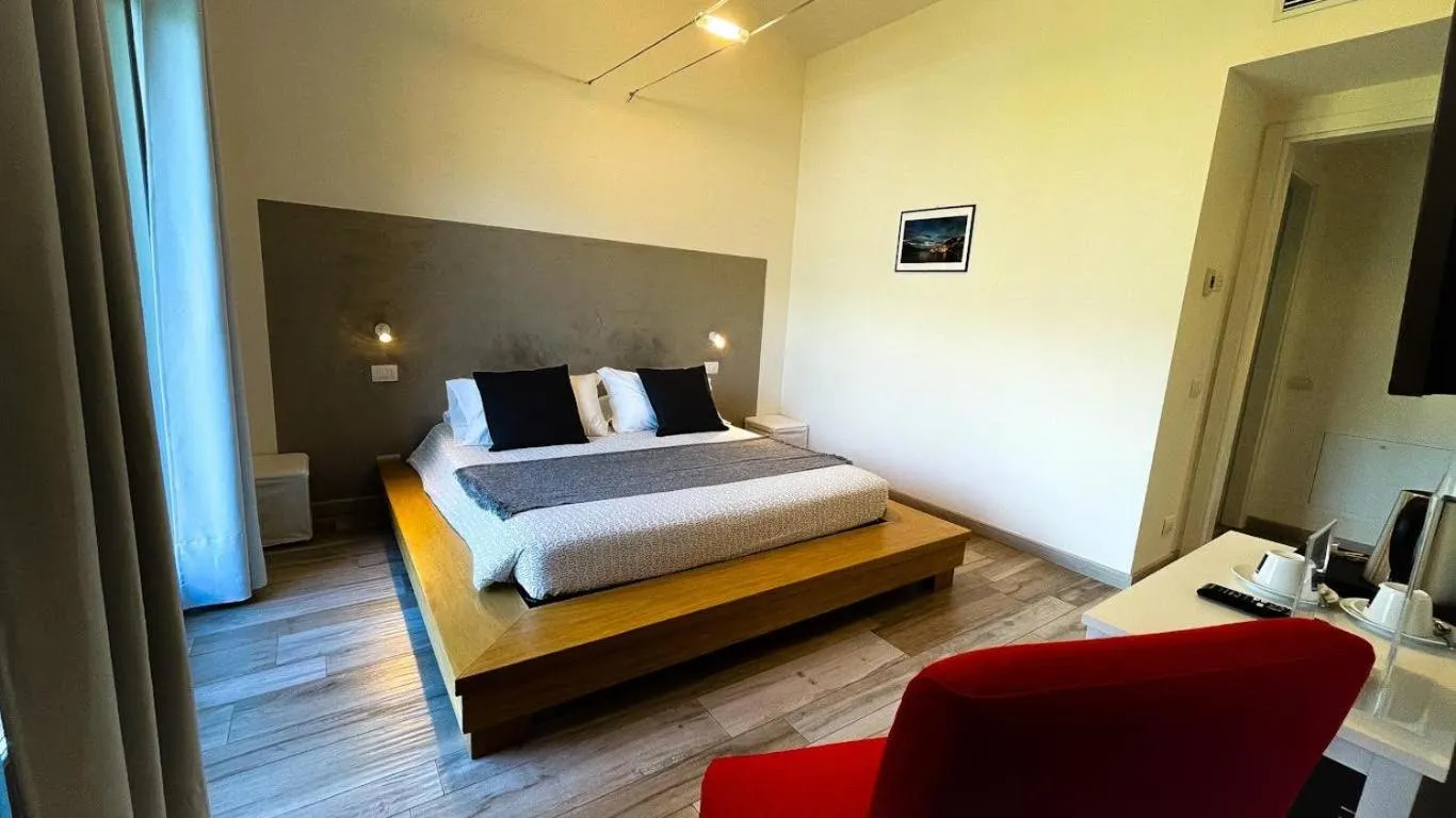 Bed in Charming Bellagio Boutique Hotel