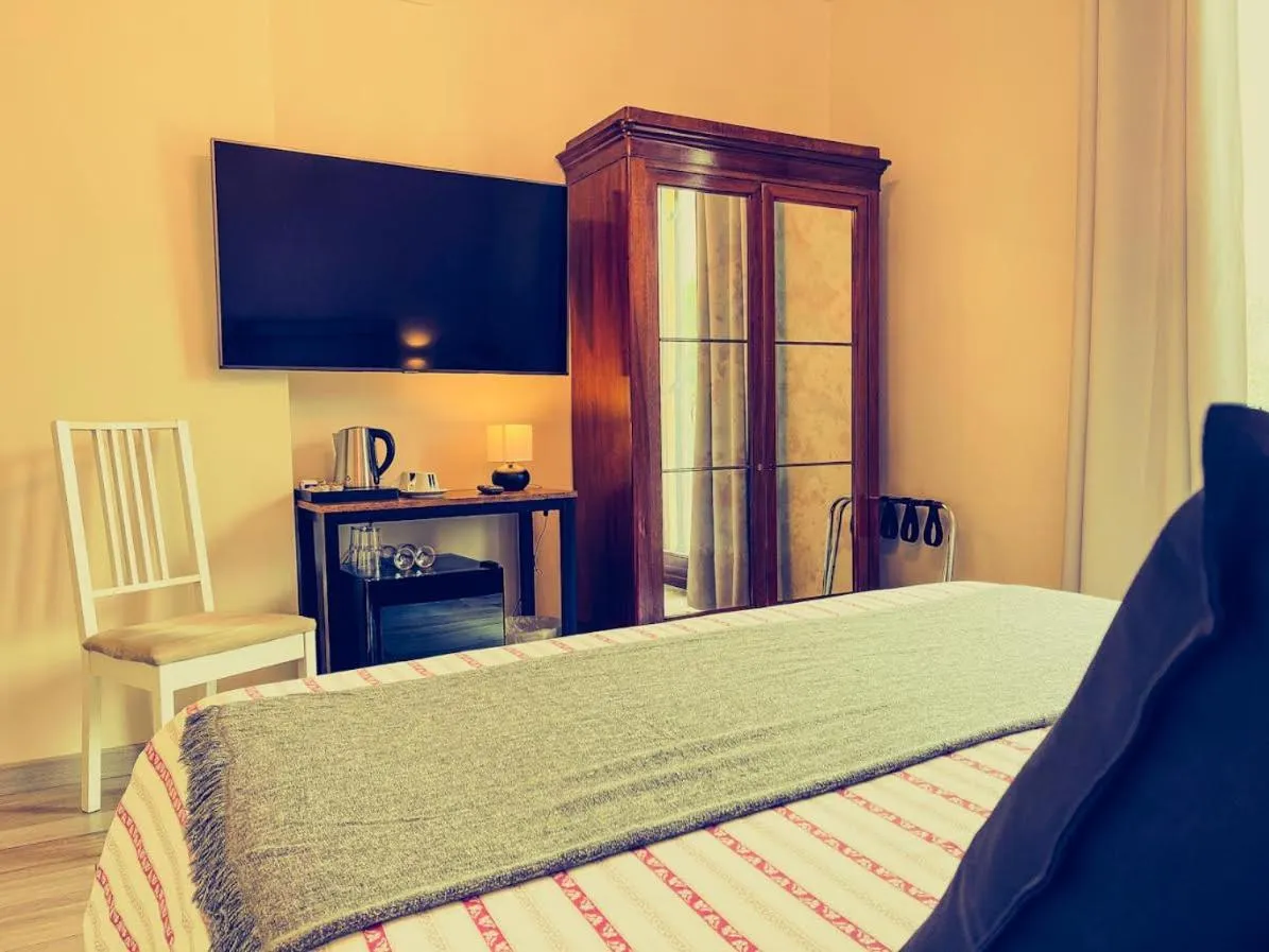 Bed in Charming Bellagio Boutique Hotel