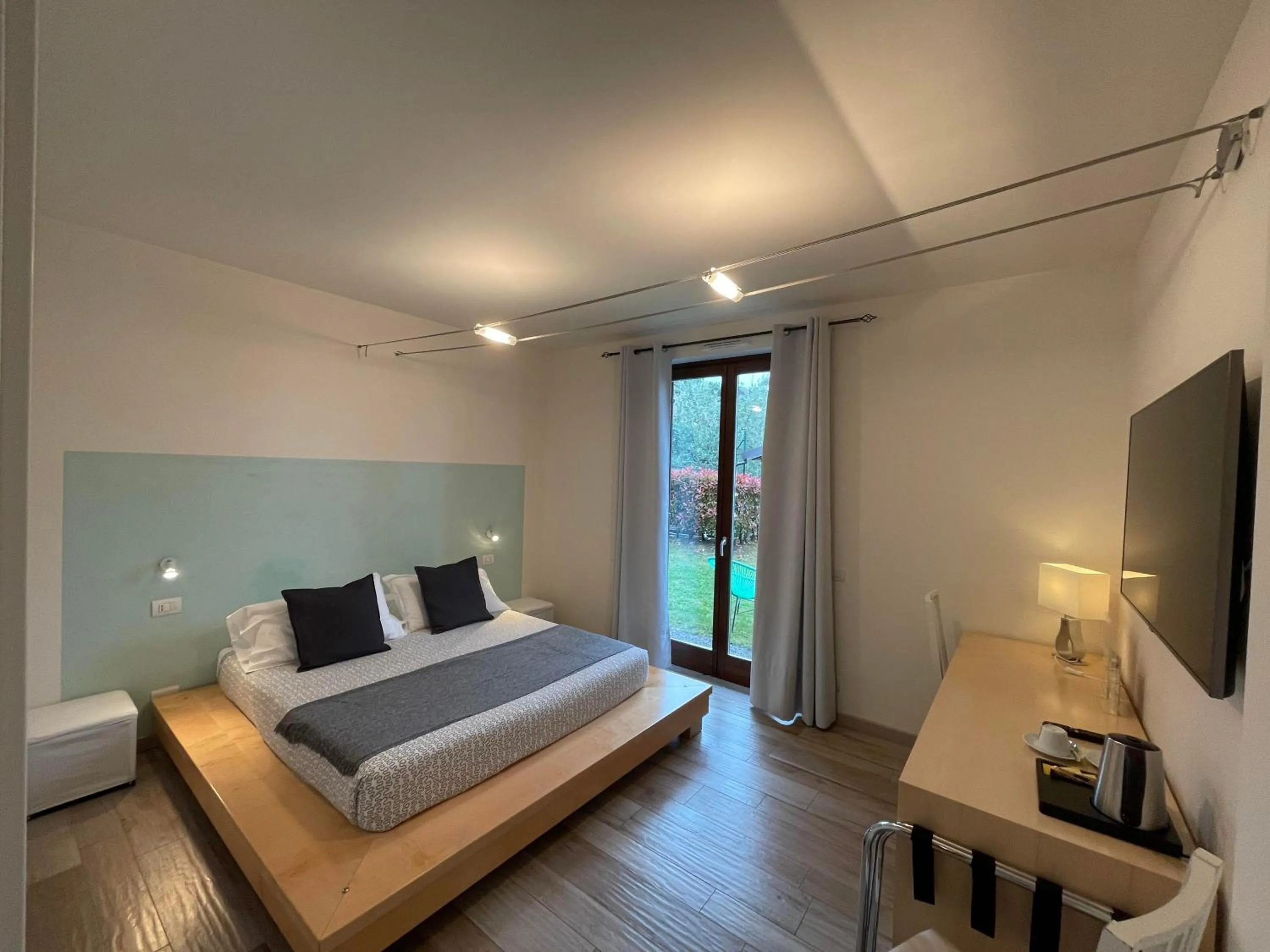 Bed in Charming Bellagio Boutique Hotel