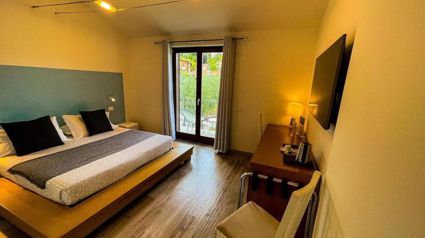 Bed in Charming Bellagio Boutique Hotel