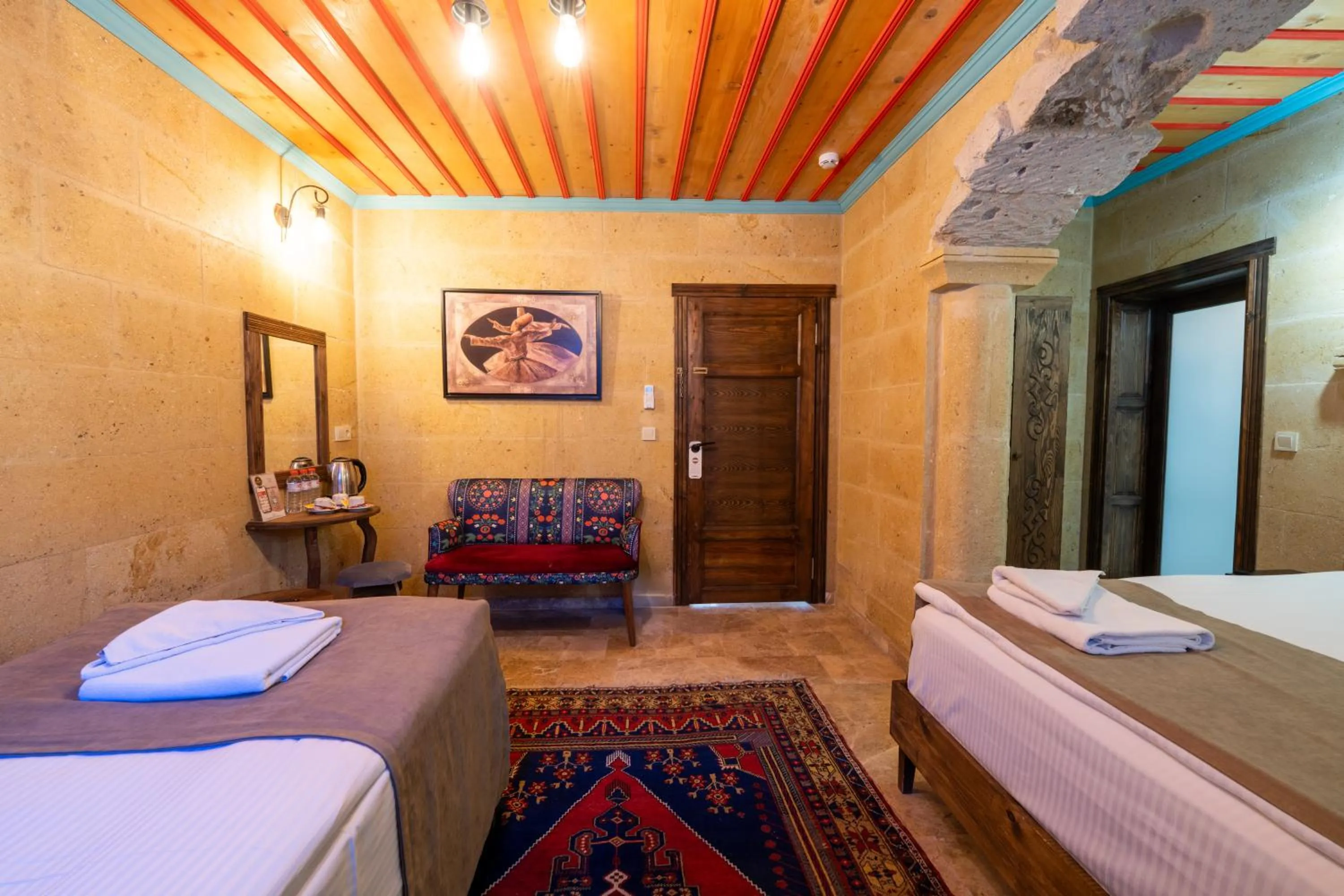 Photo of the whole room, Bed in Rustic Caves