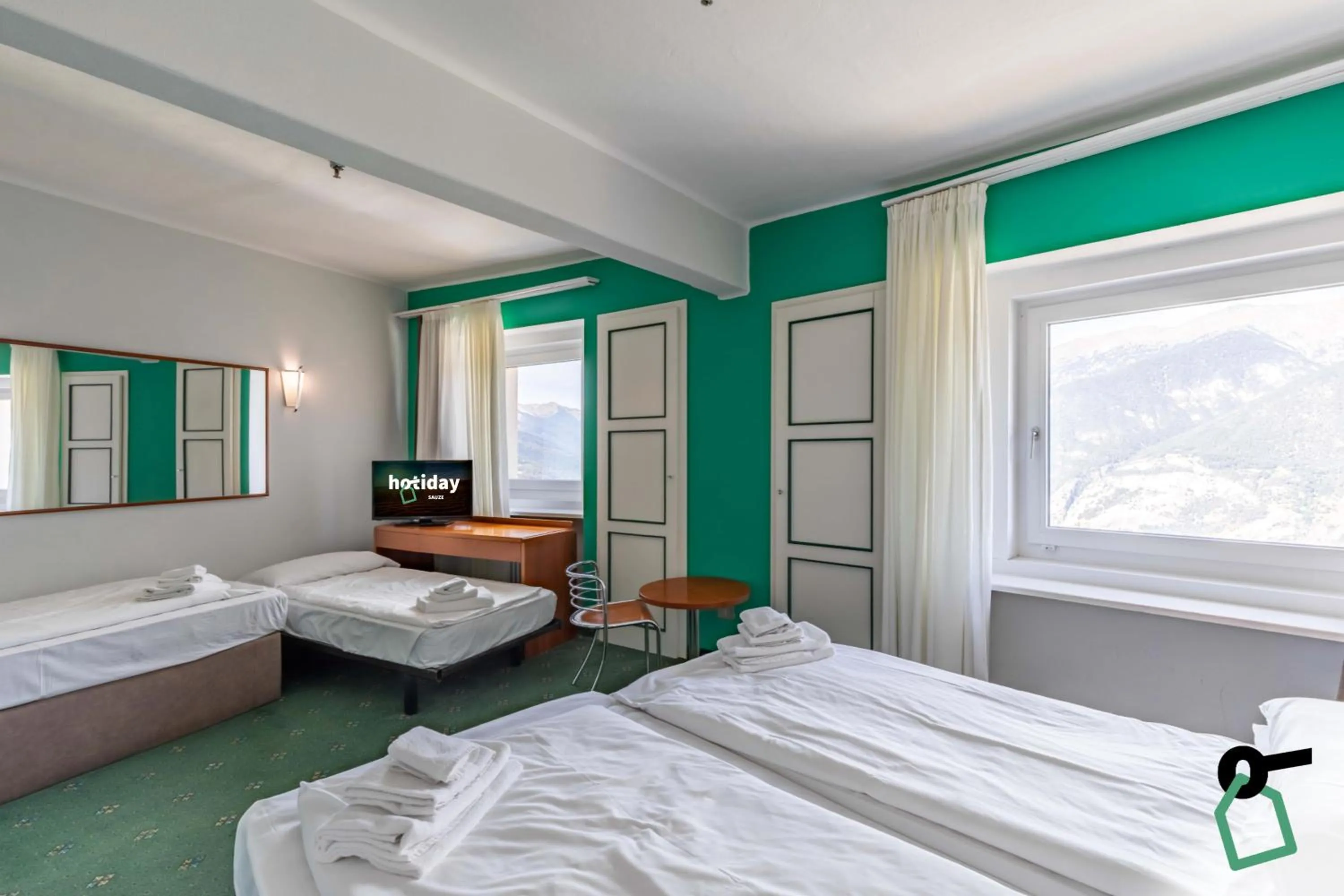 Photo of the whole room, Bed in Hotiday Sauze Torre