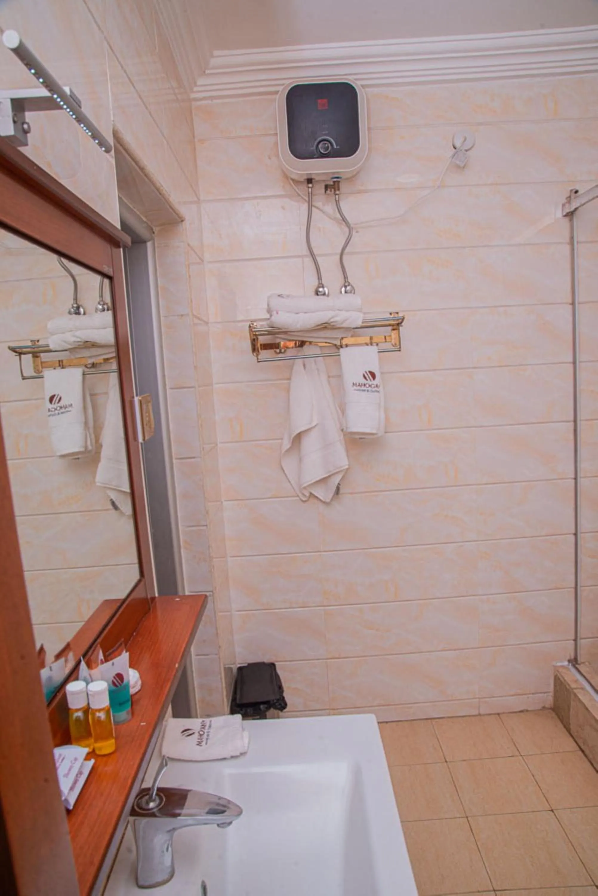 Toilet in MAHOGANY HOTEL AND SUITES