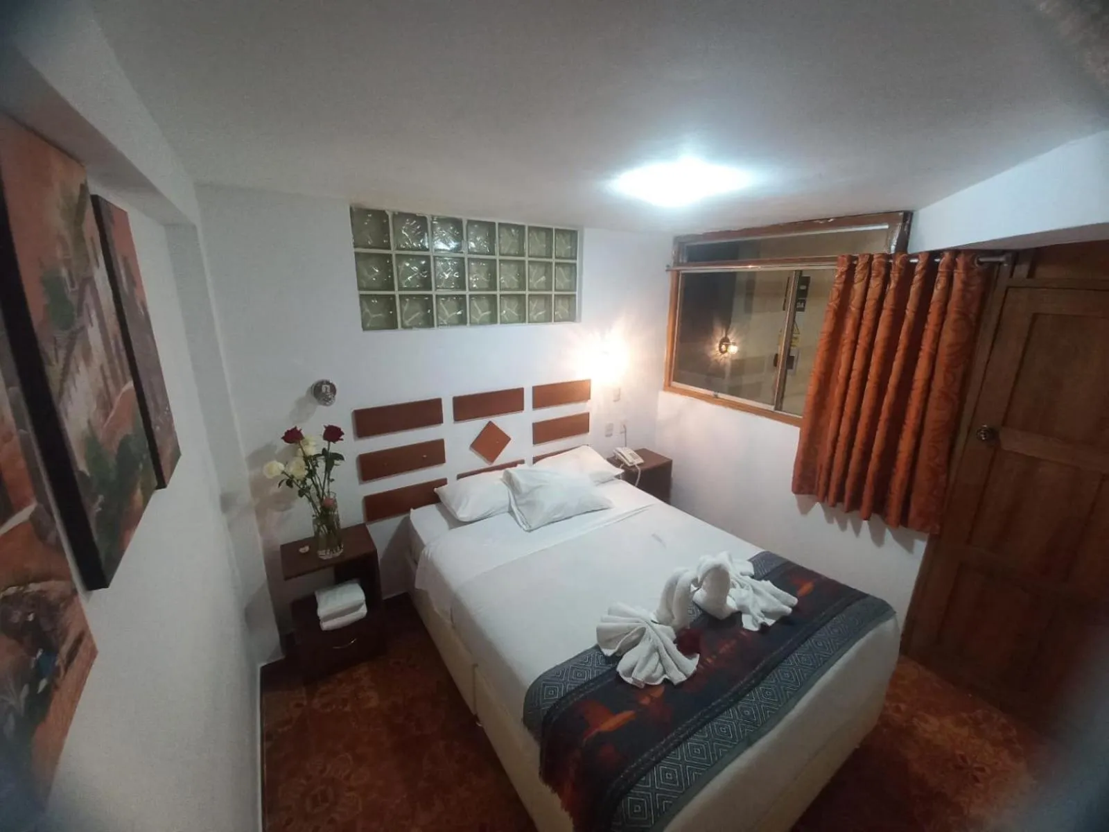 Bed in PAQARIQ INN HOTEL