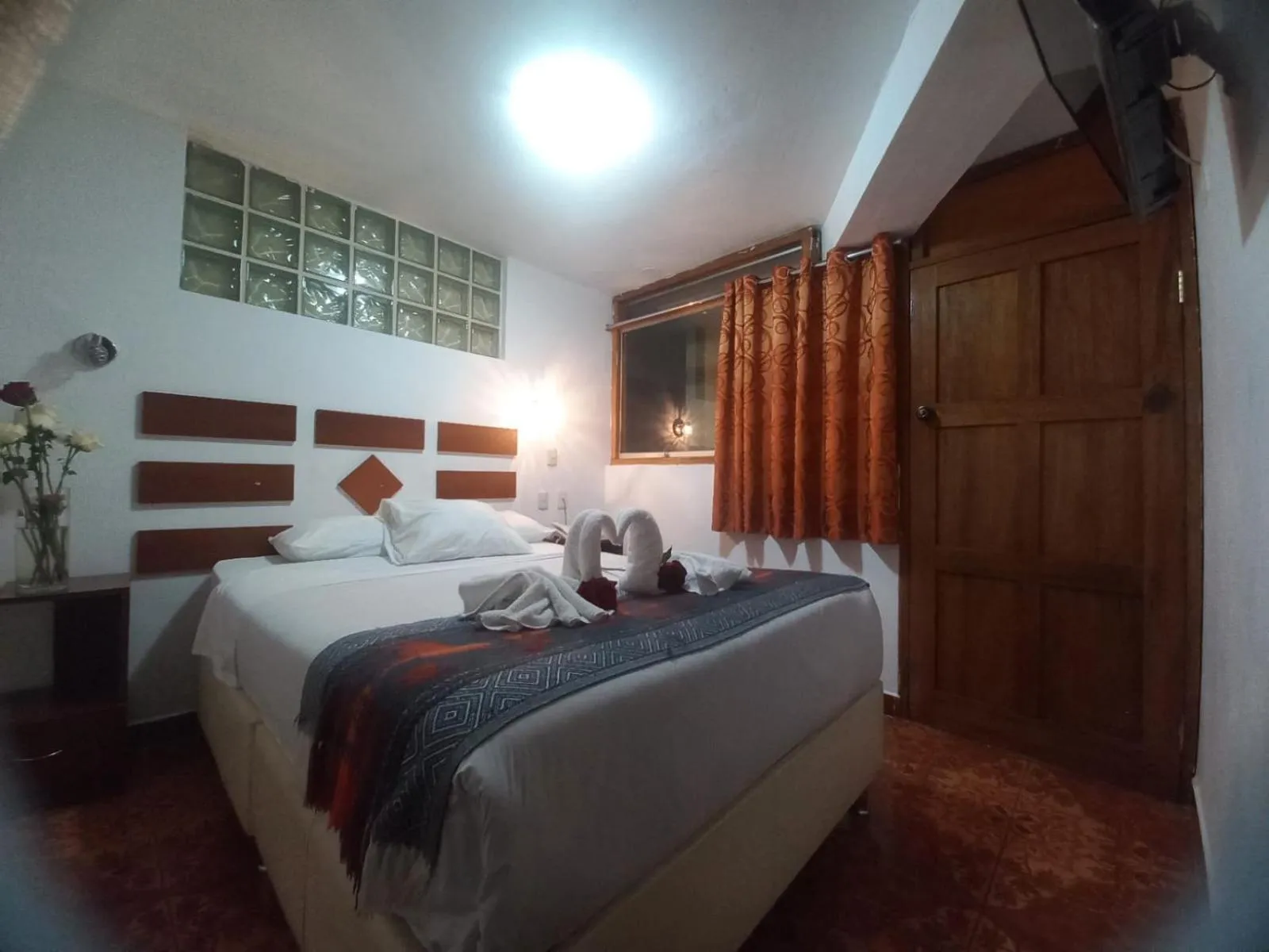 Bed in PAQARIQ INN HOTEL