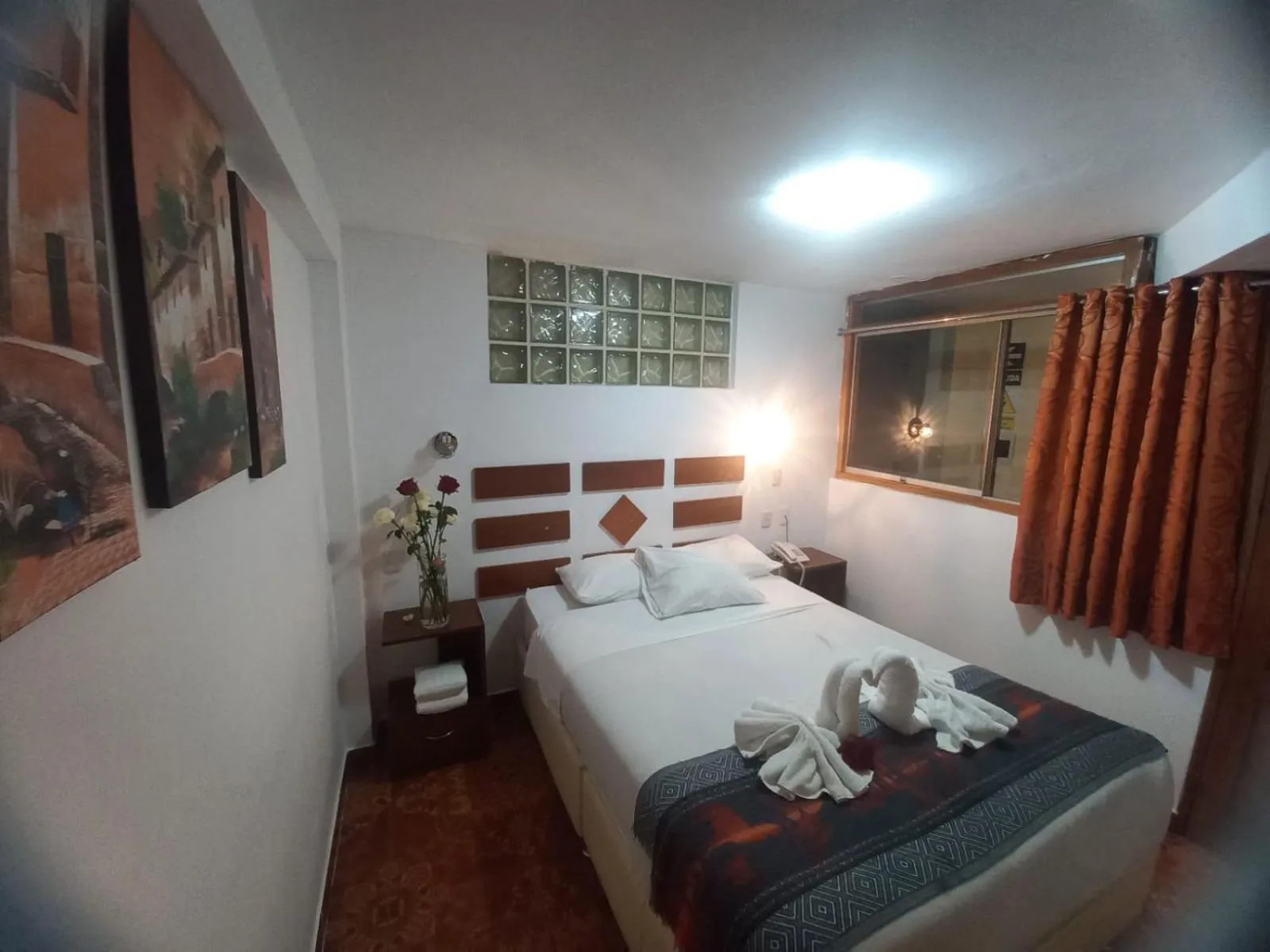 Bed in PAQARIQ INN HOTEL