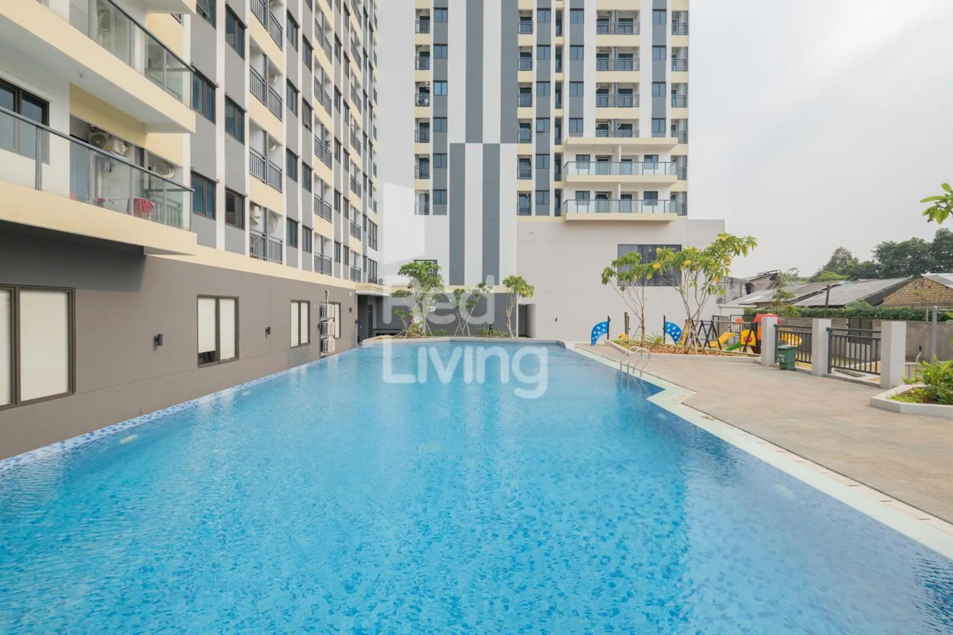 Swimming pool in RedLiving Apartemen Jakarta Living Star - BoboRooms