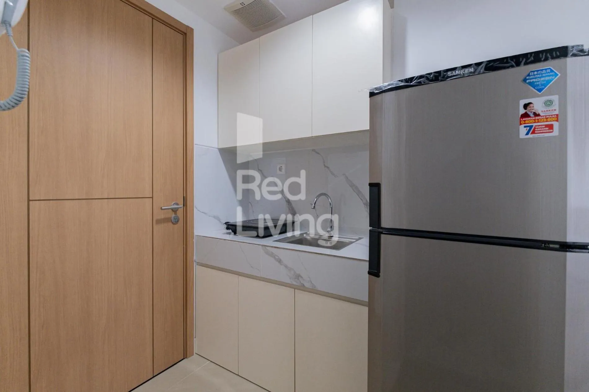 Kitchen or kitchenette in RedLiving Apartemen Jakarta Living Star - BoboRooms