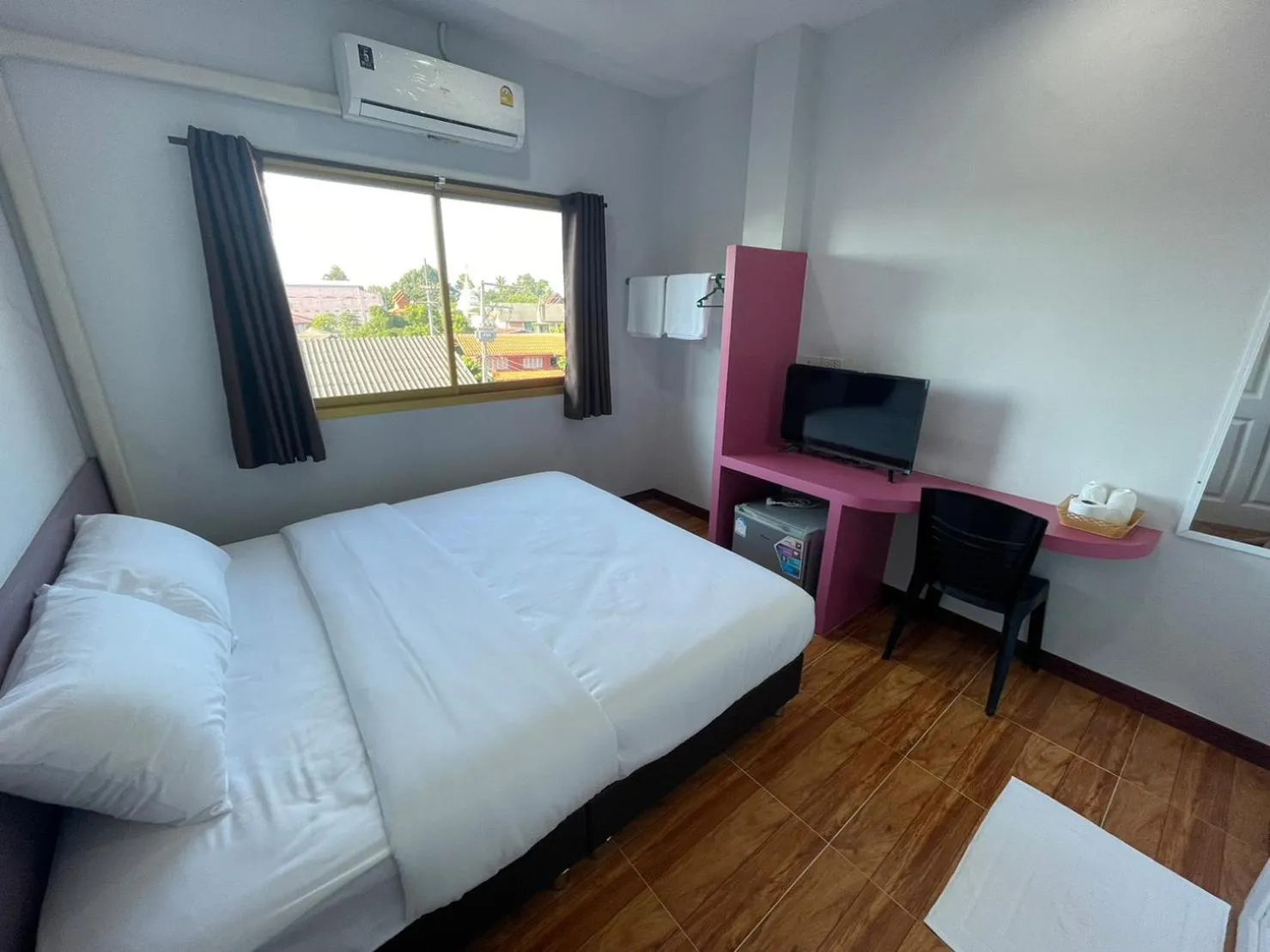 Bed in Chiang Kham Ruk Khun Hotel