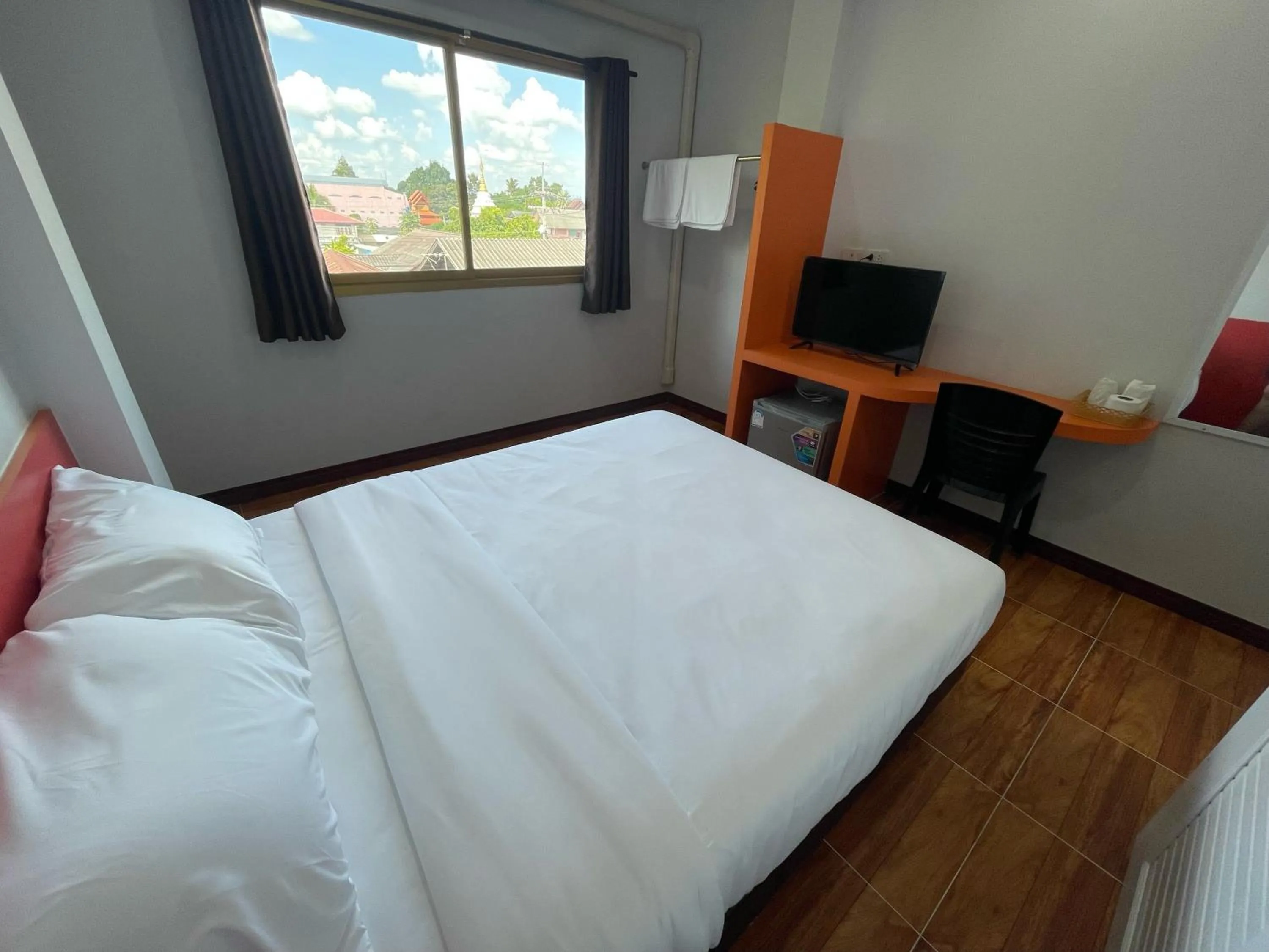 Bed in Chiang Kham Ruk Khun Hotel