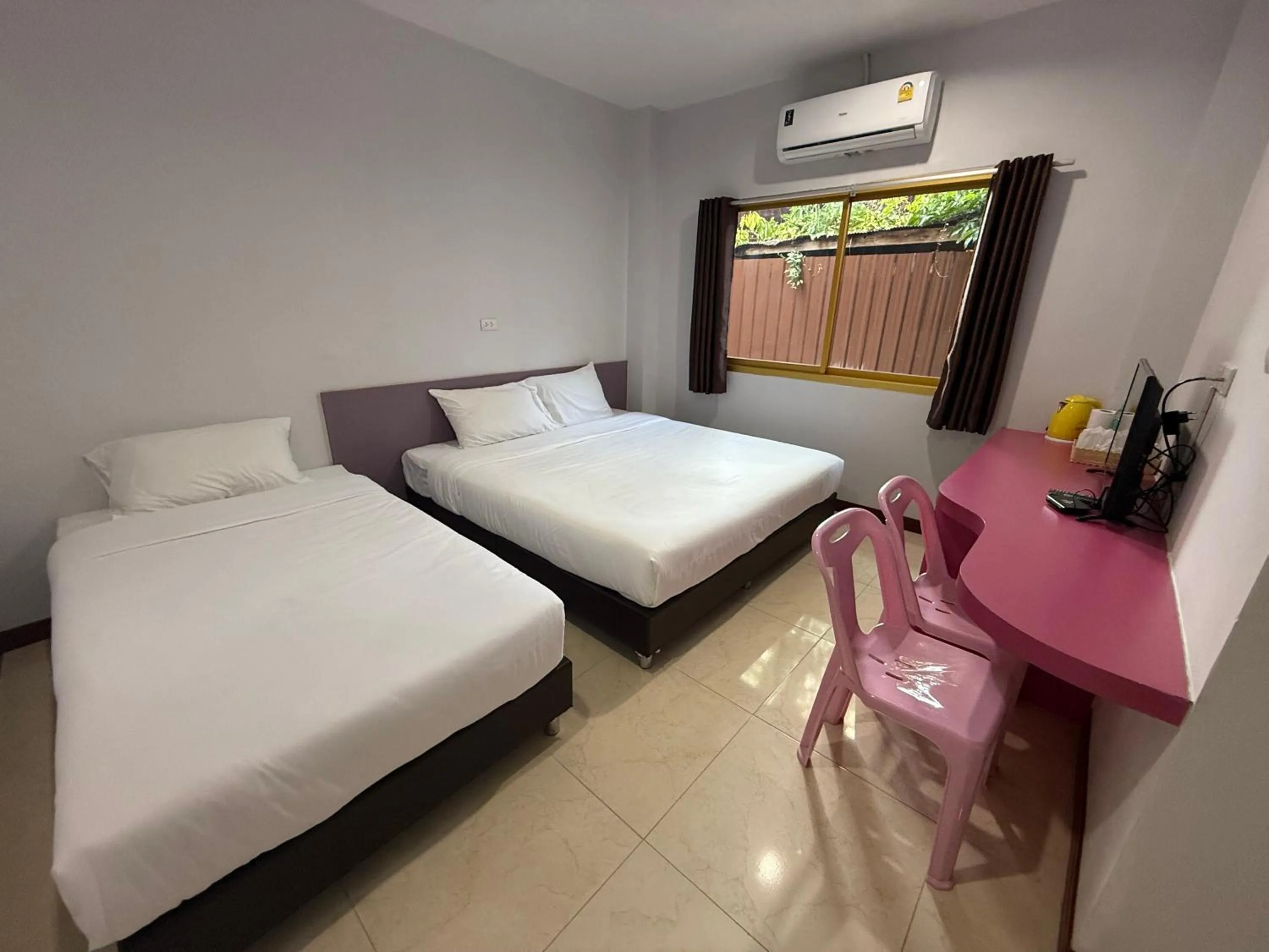 Bed in Chiang Kham Ruk Khun Hotel