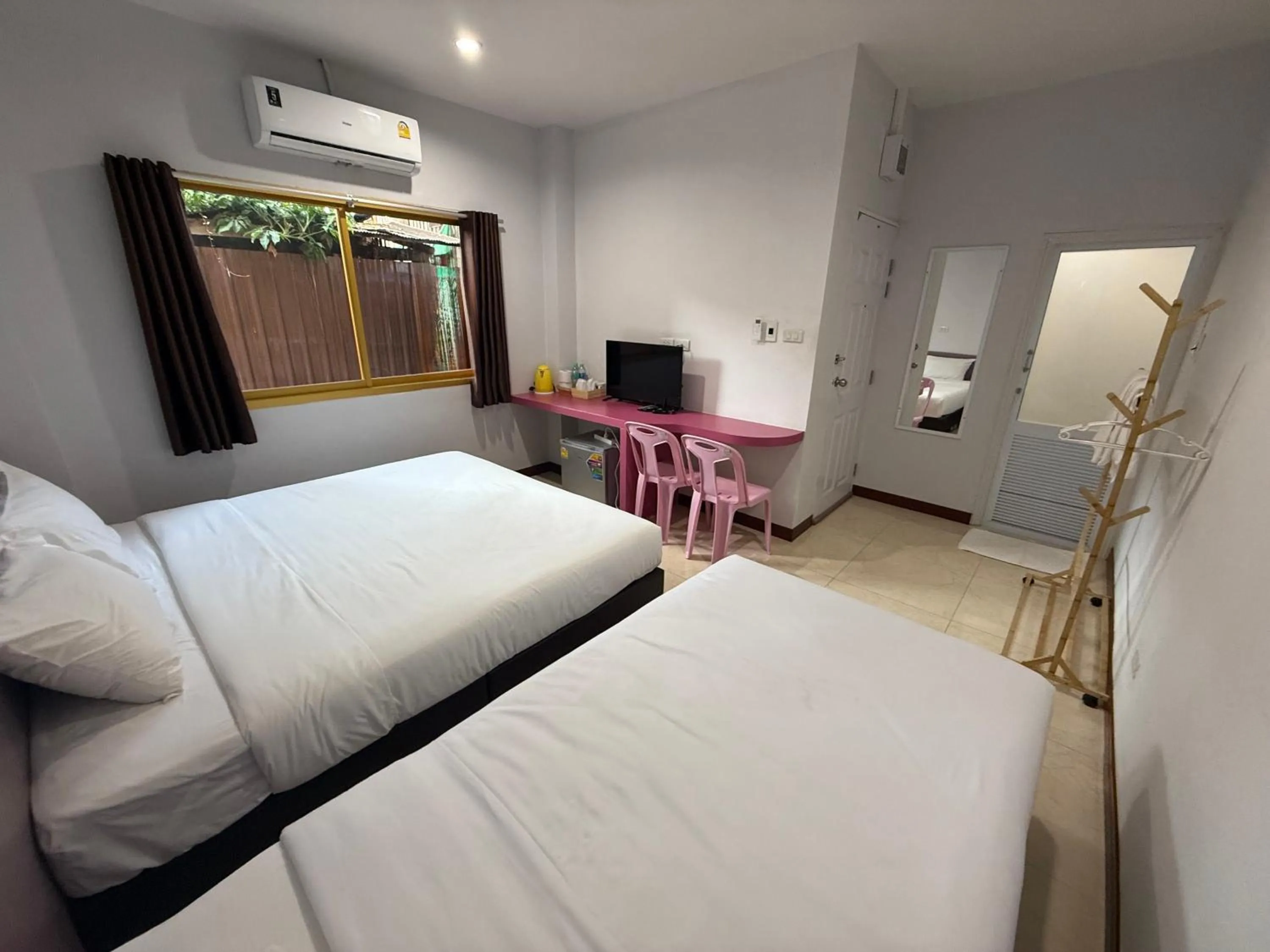 Bed in Chiang Kham Ruk Khun Hotel