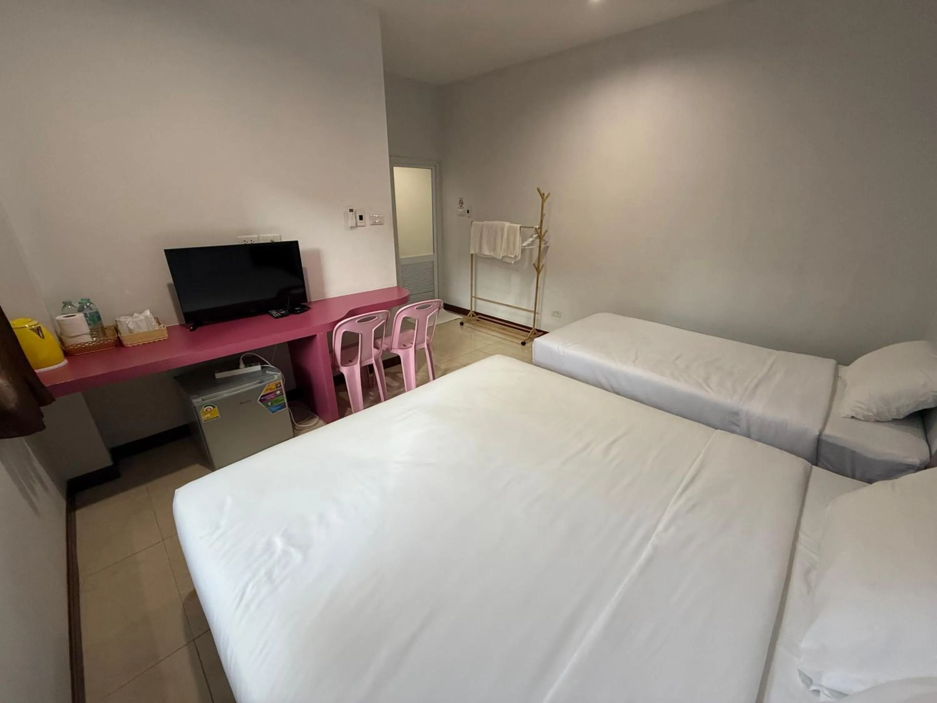 Bed in Chiang Kham Ruk Khun Hotel