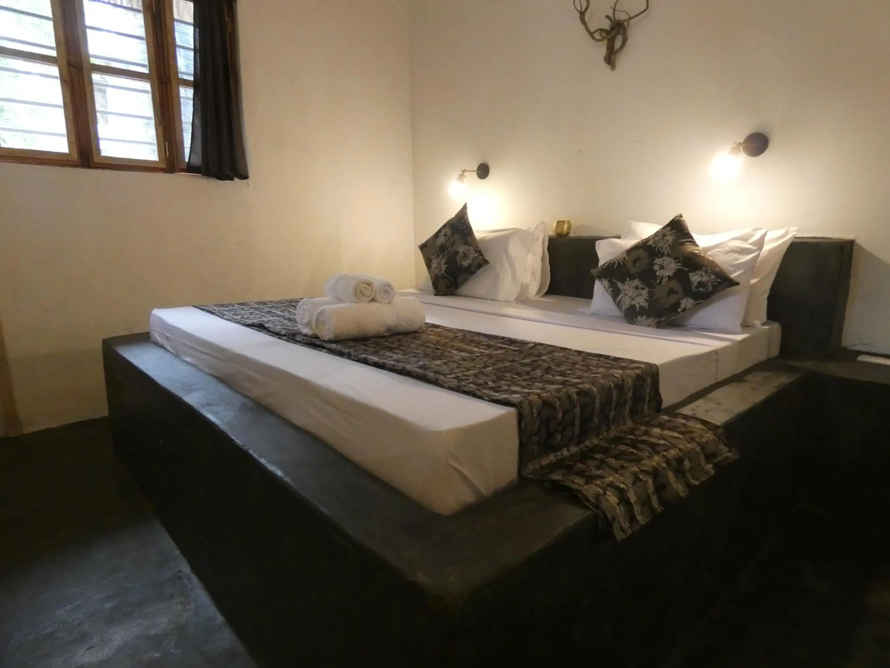 Bed in Bahari Beach Bungalows