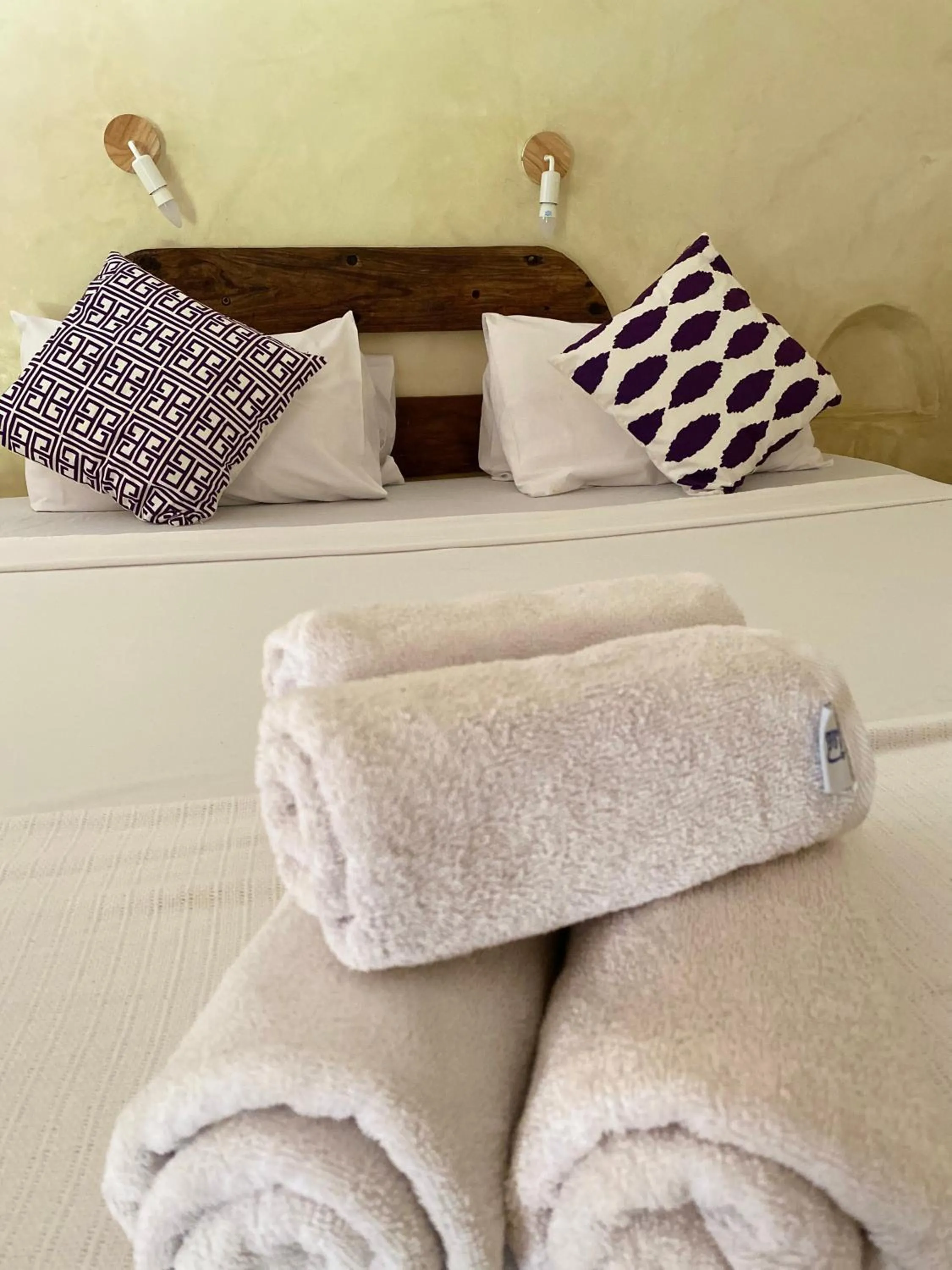 Bed in Bahari Beach Bungalows