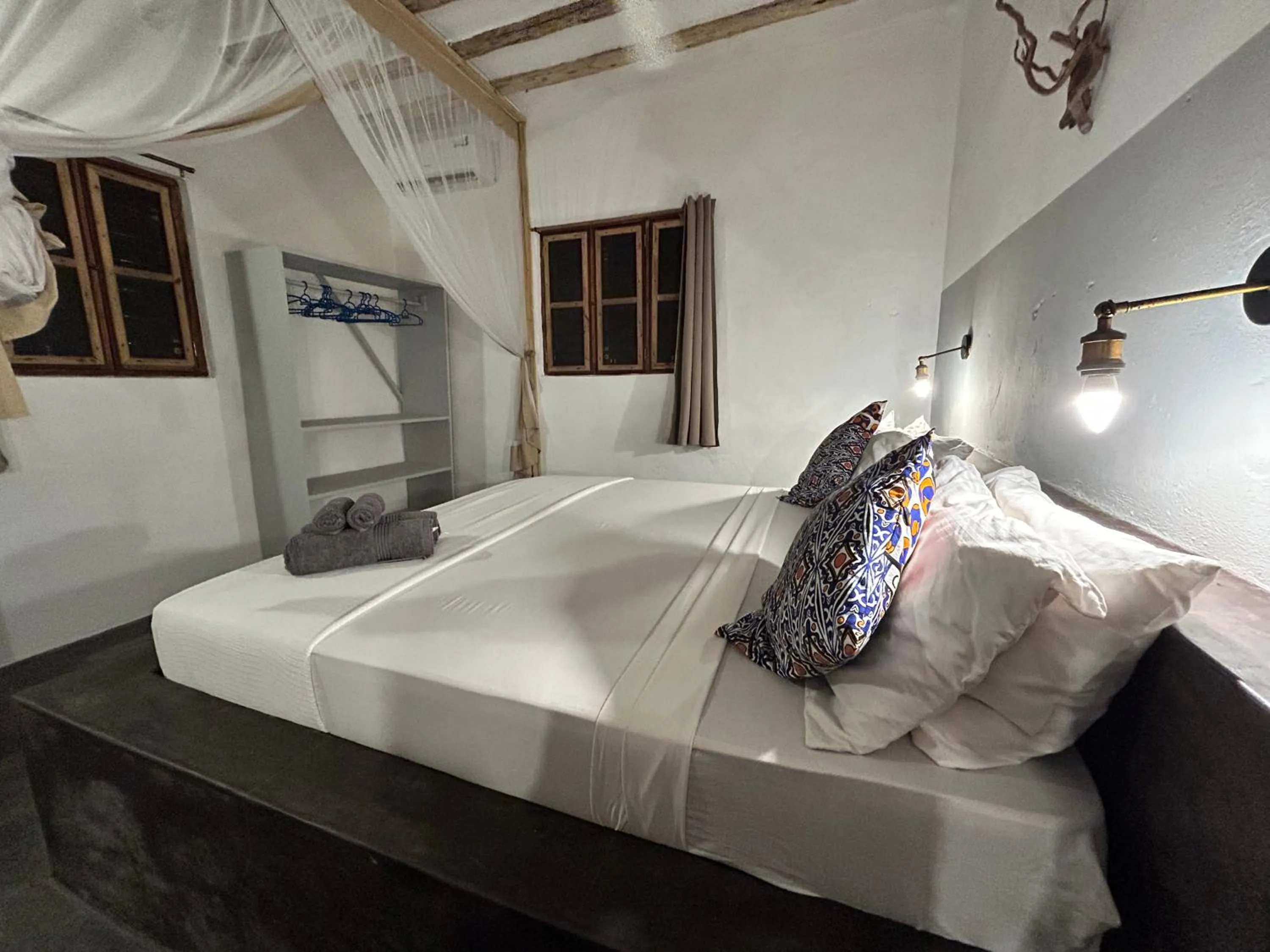 Bed in Bahari Beach Bungalows