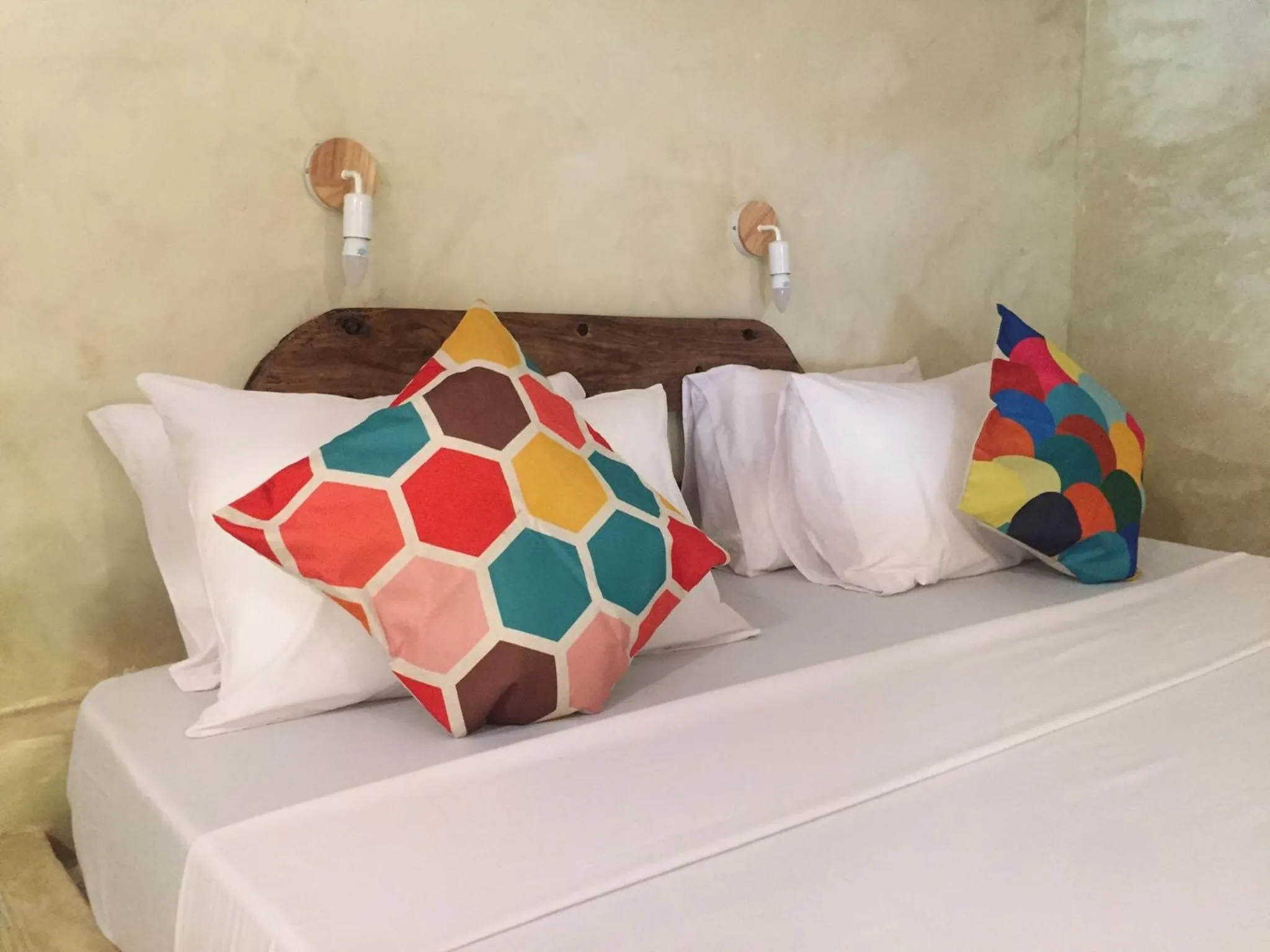 Bed in Bahari Beach Bungalows