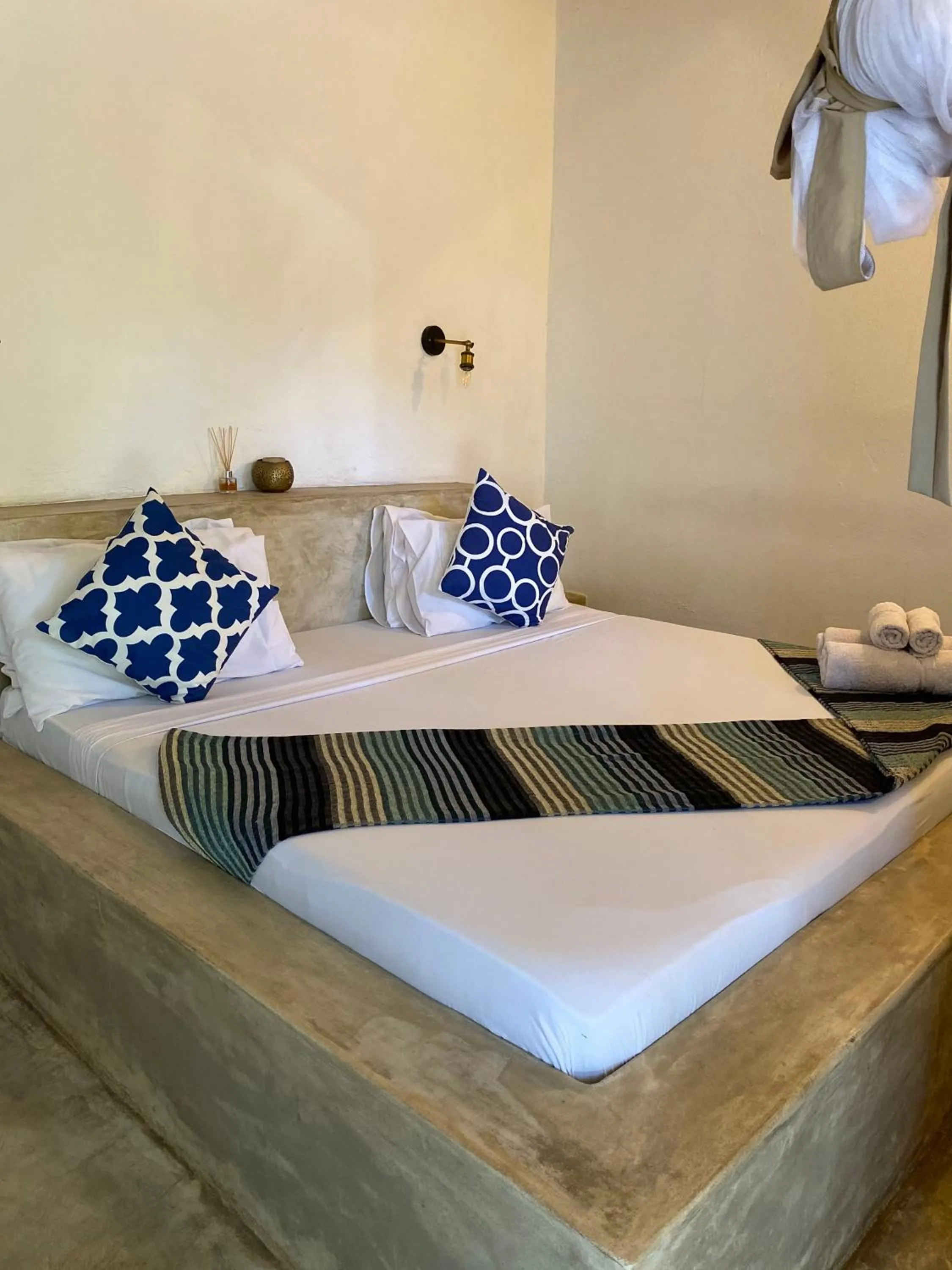Bed in Bahari Beach Bungalows