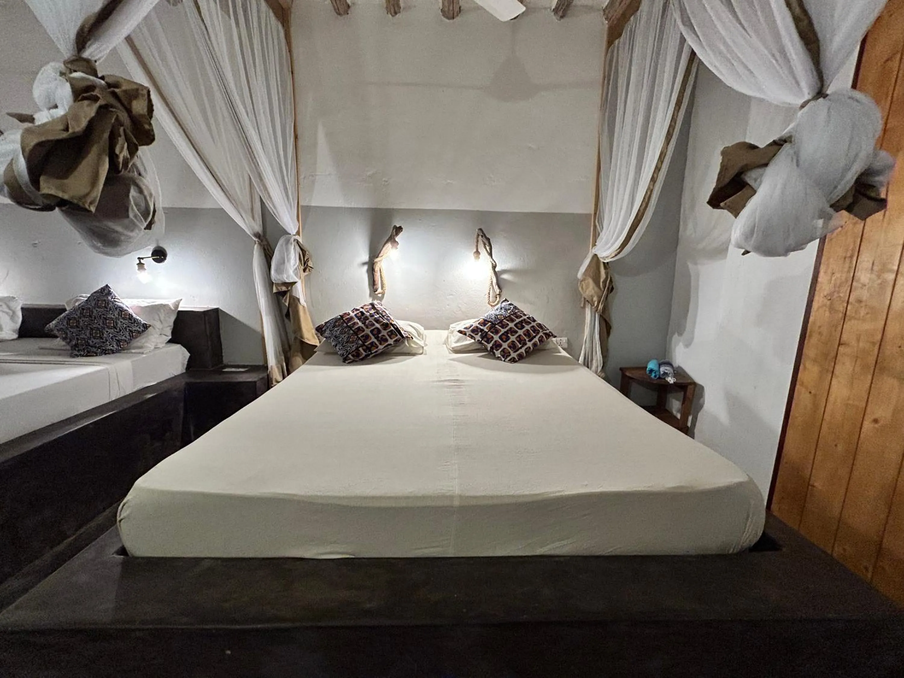 Bed in Bahari Beach Bungalows