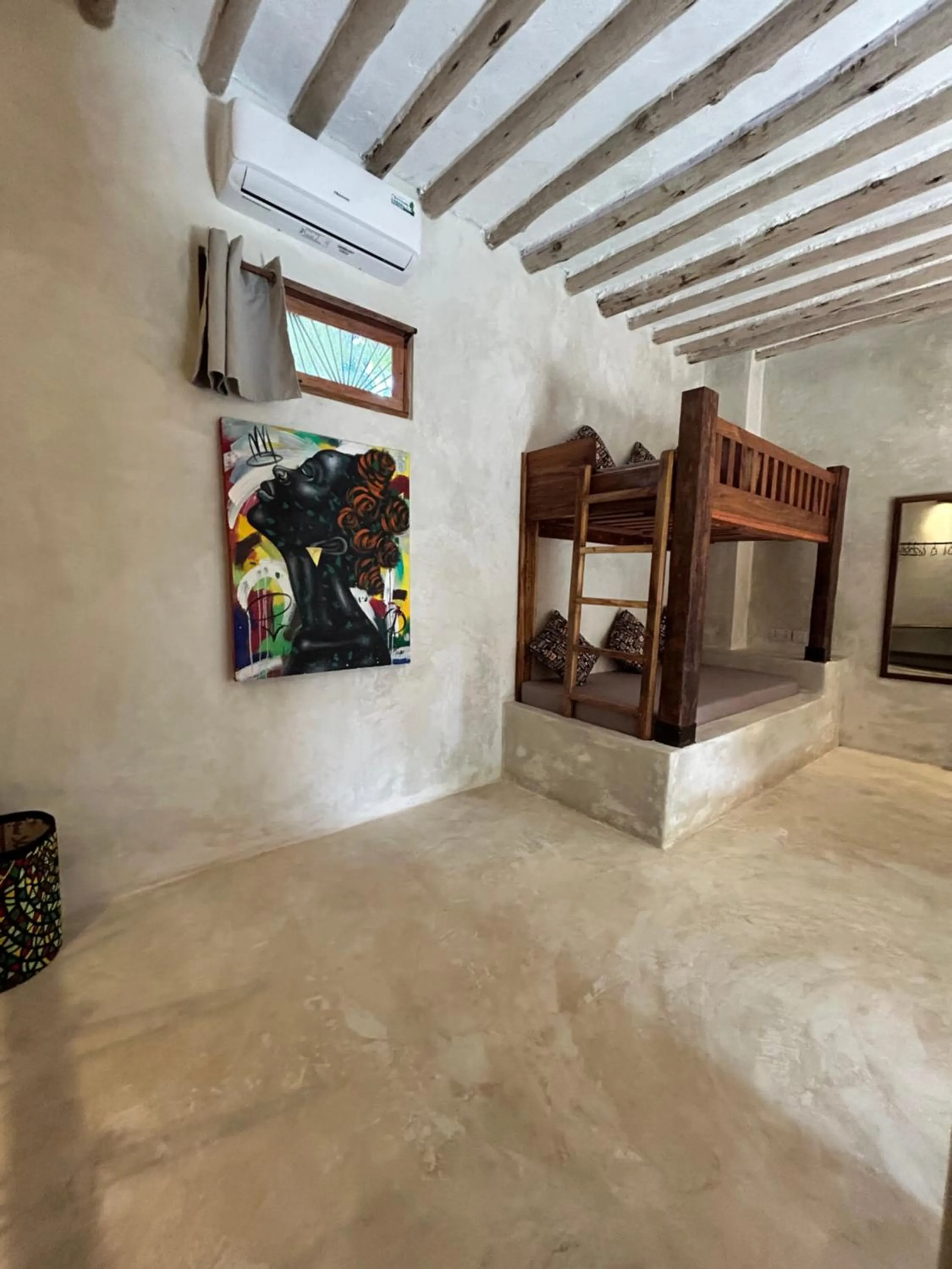 Bed in Bahari Beach Bungalows