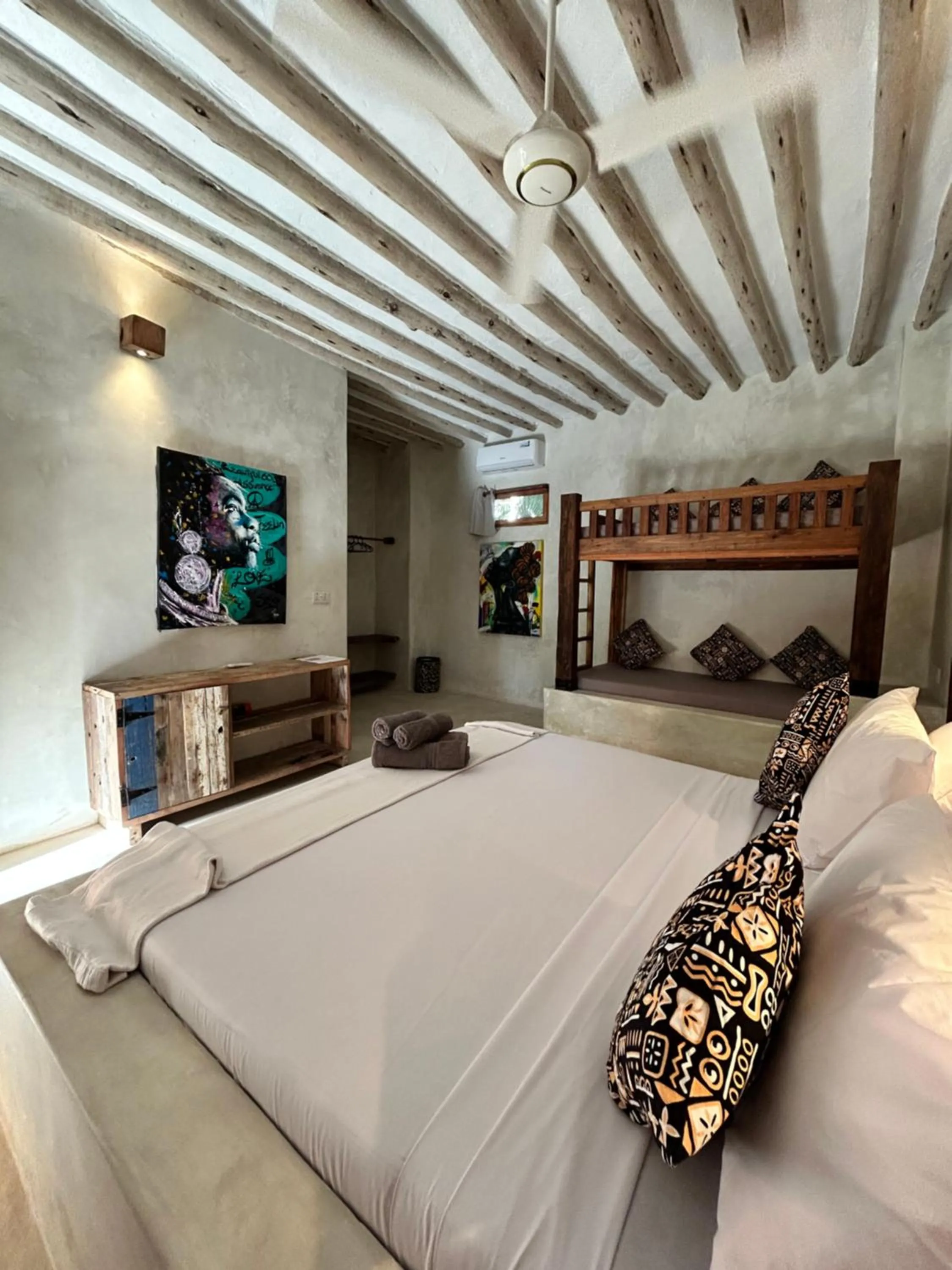 Bed in Bahari Beach Bungalows