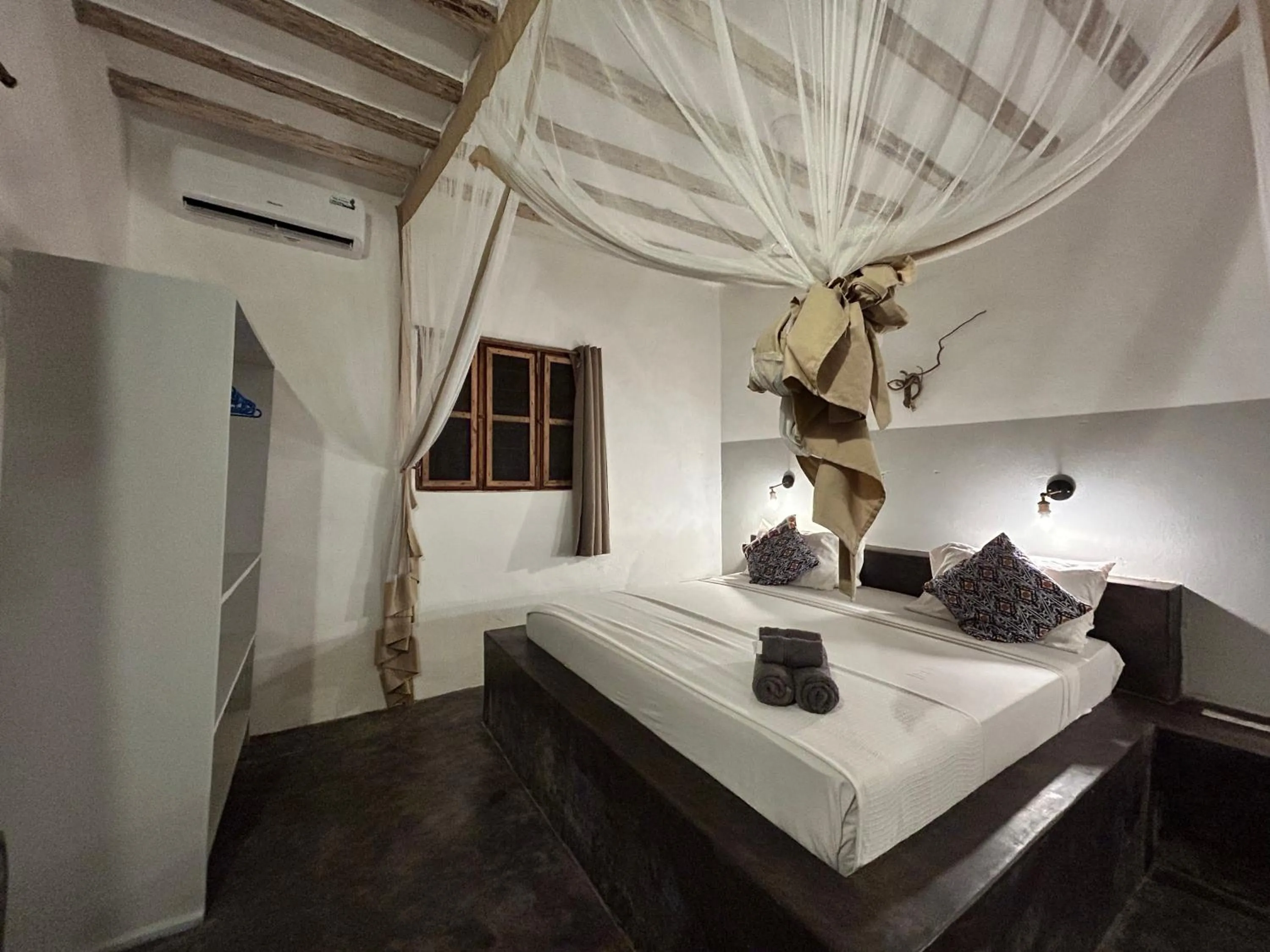 Bed in Bahari Beach Bungalows