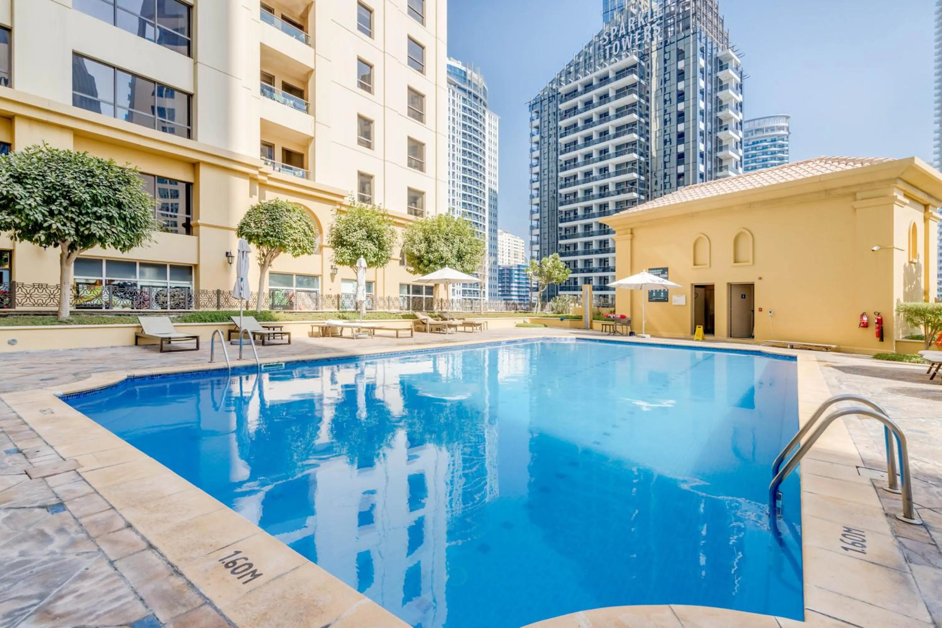 Swimming pool in GLOBALSTAY. Modern Apartments steps to JBR Beach