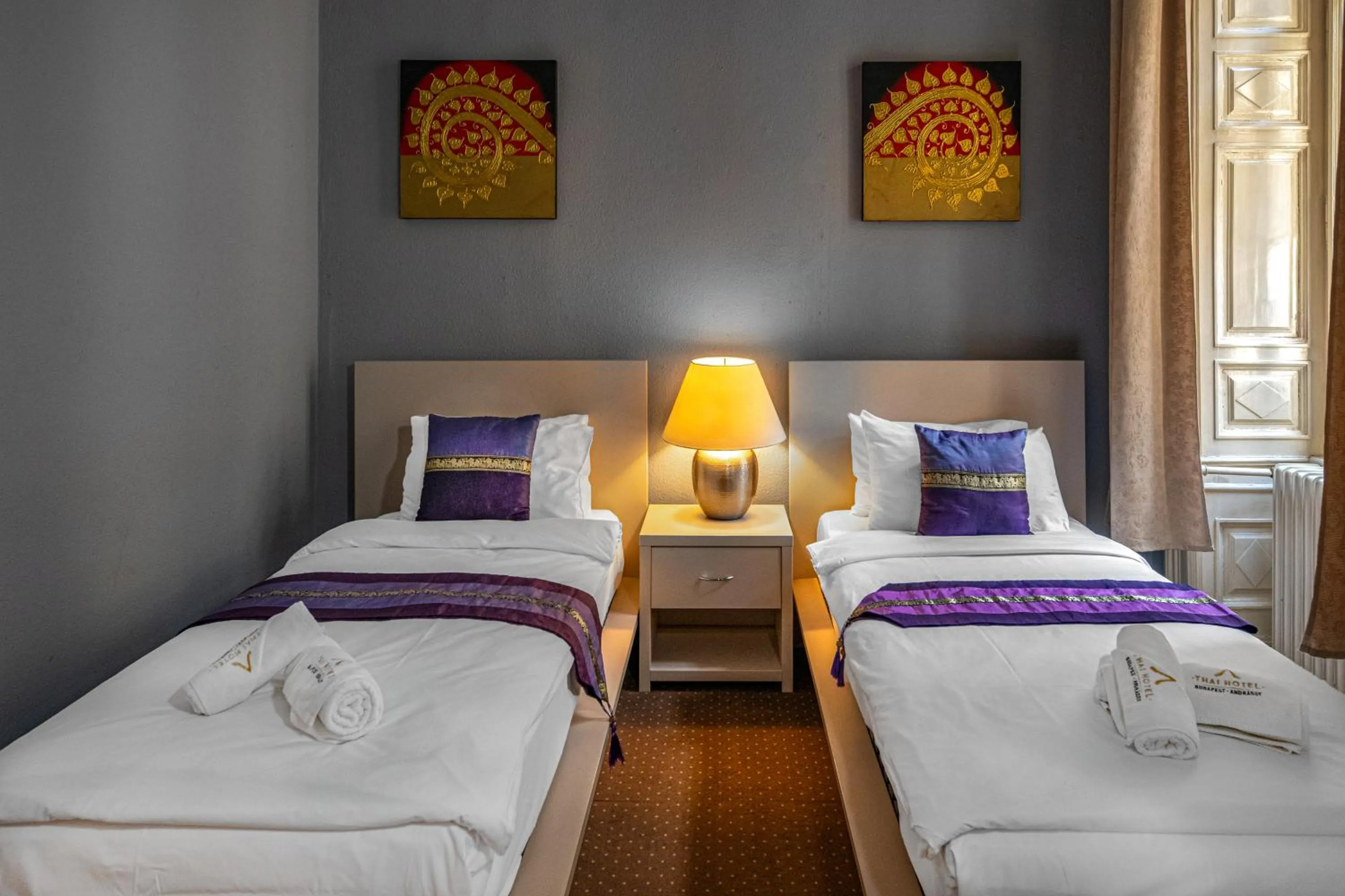 Bed in Andrassy Thai Hotel