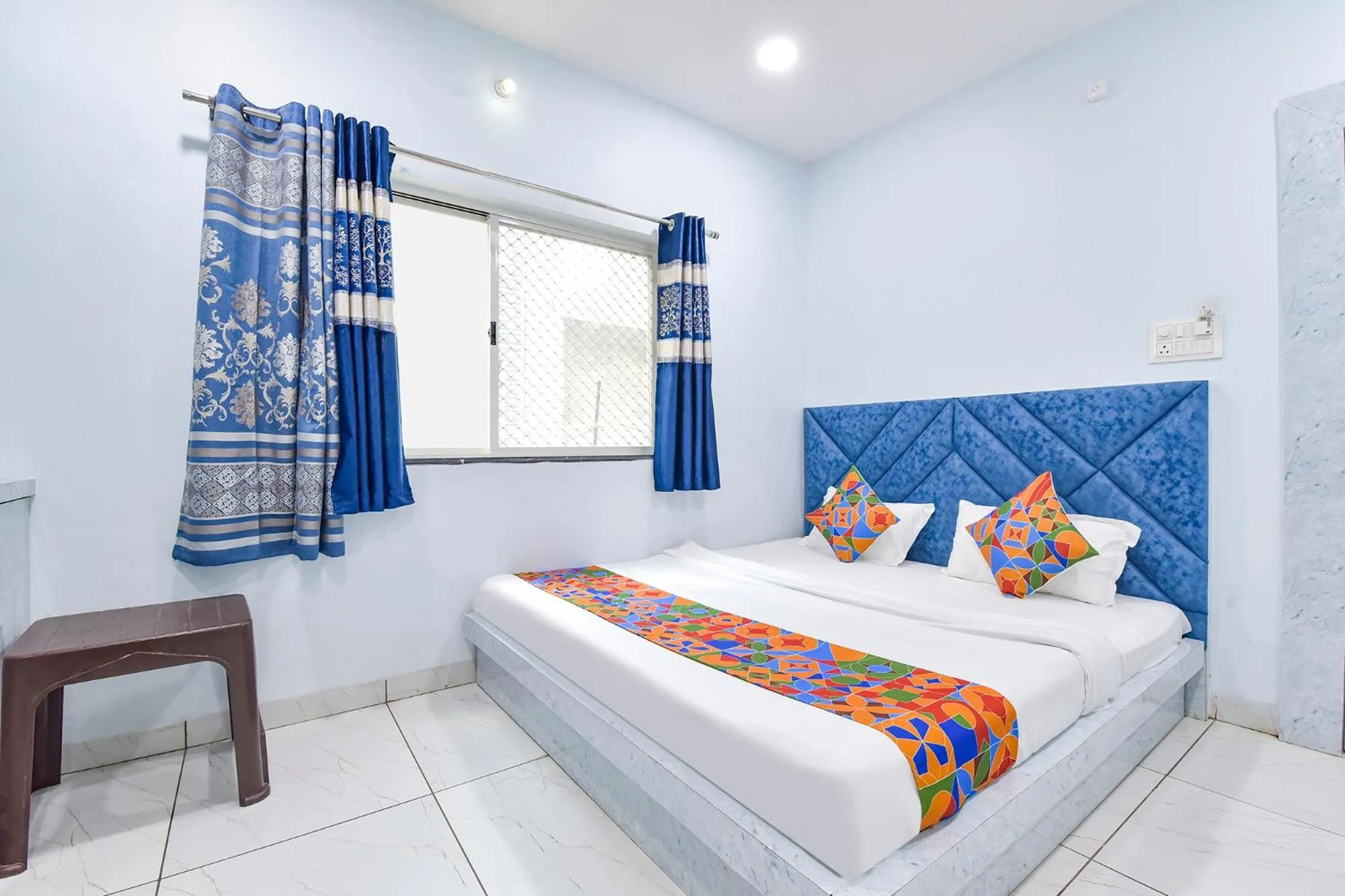 Bed in FabHotel Somnath