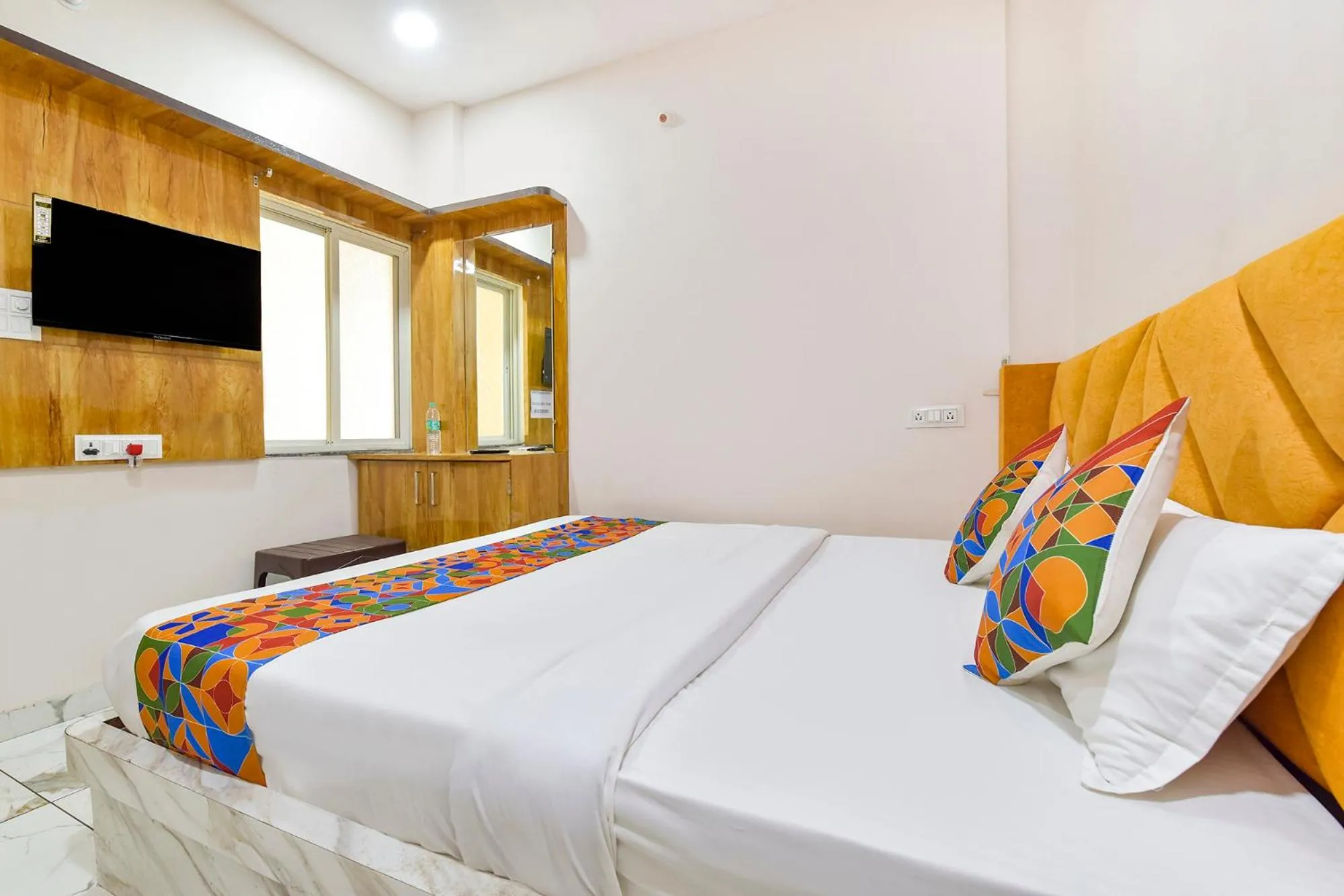 Bed in FabHotel Somnath