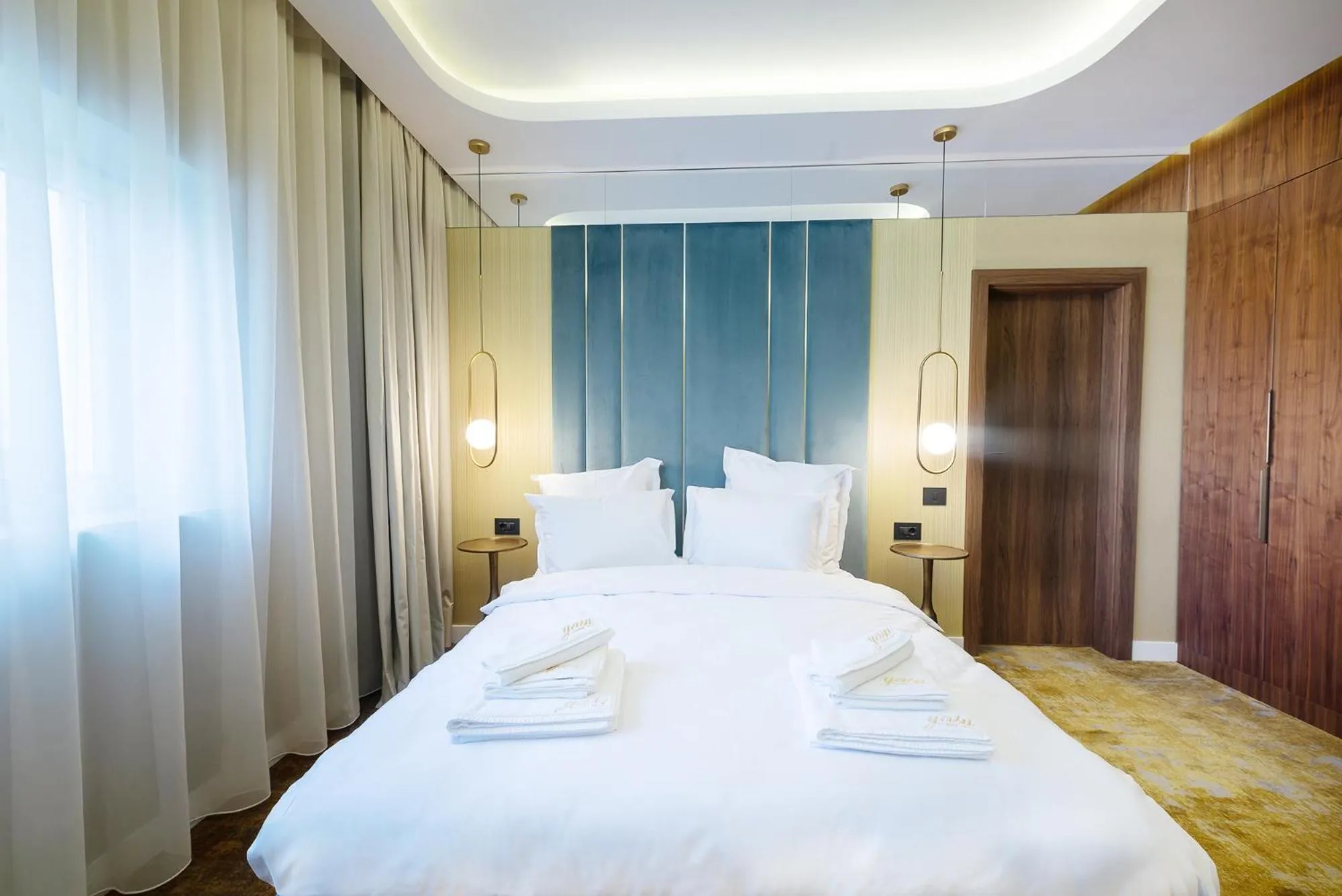 Bed in Yasu Luxury Rooms