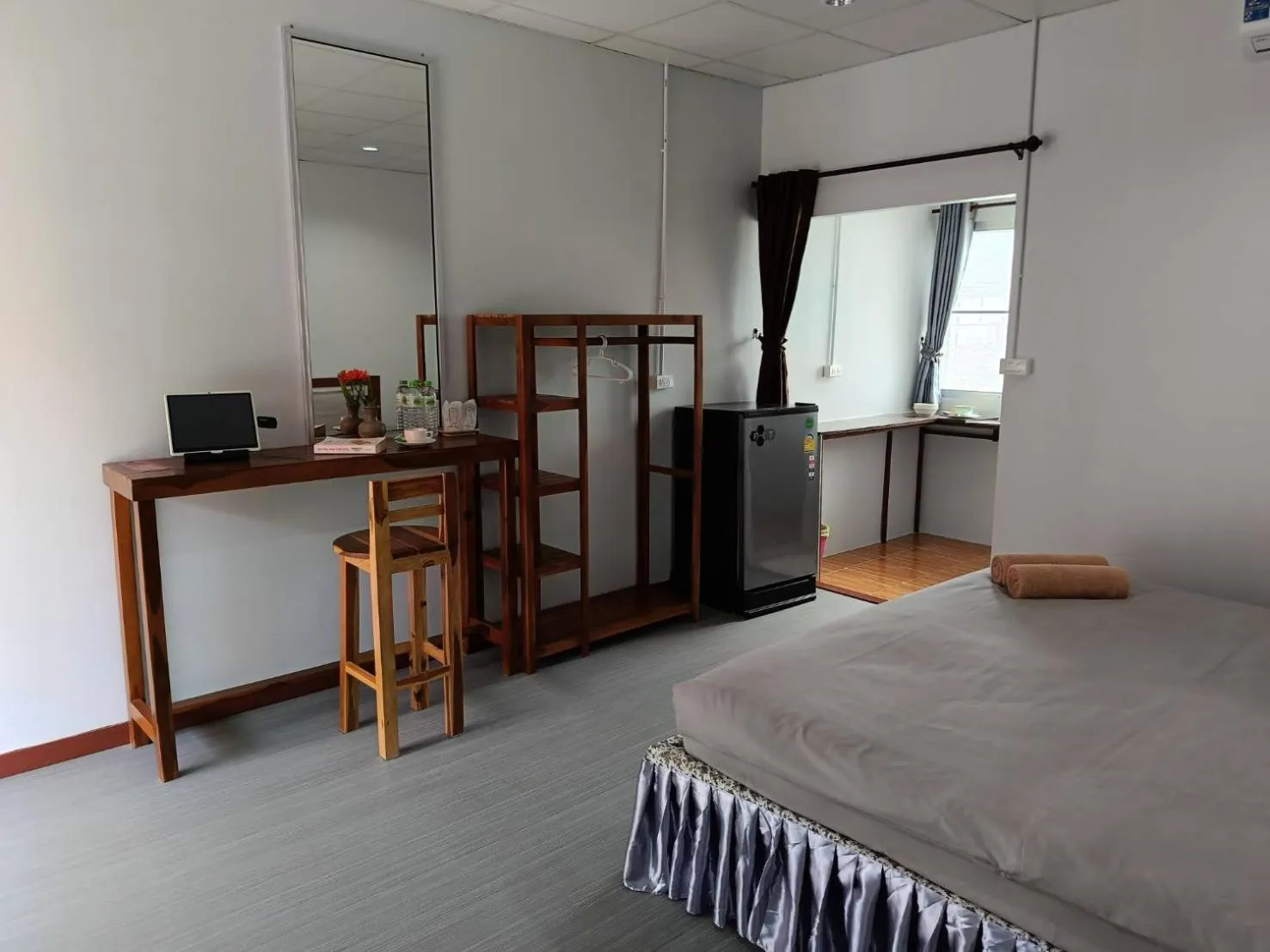 Bed in Lovely Paradise Phangan Hotel