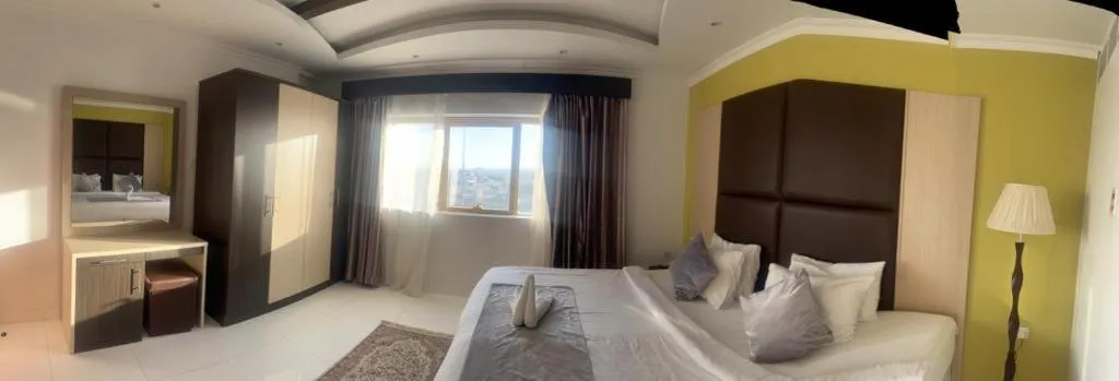View (from property/room), Bed in SADARA HOTELS APARTMENTS
