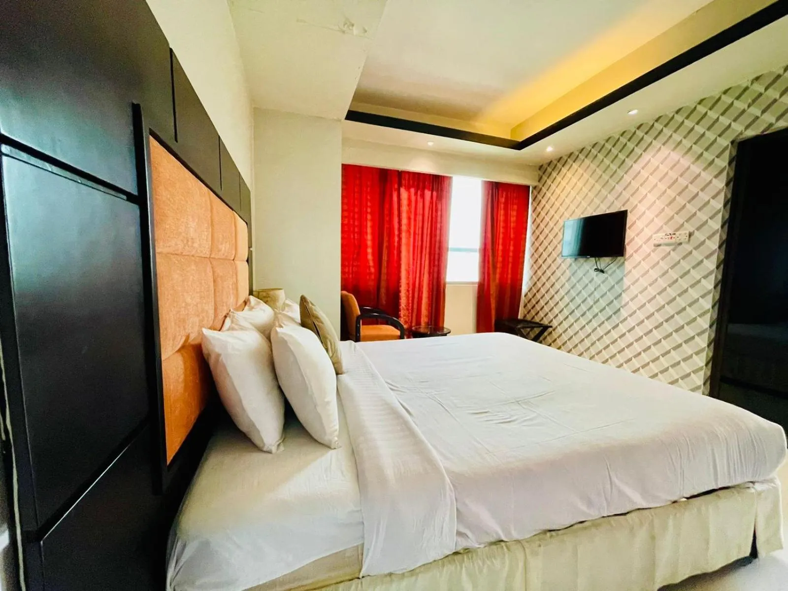 Bed in Orchid Business Hotel