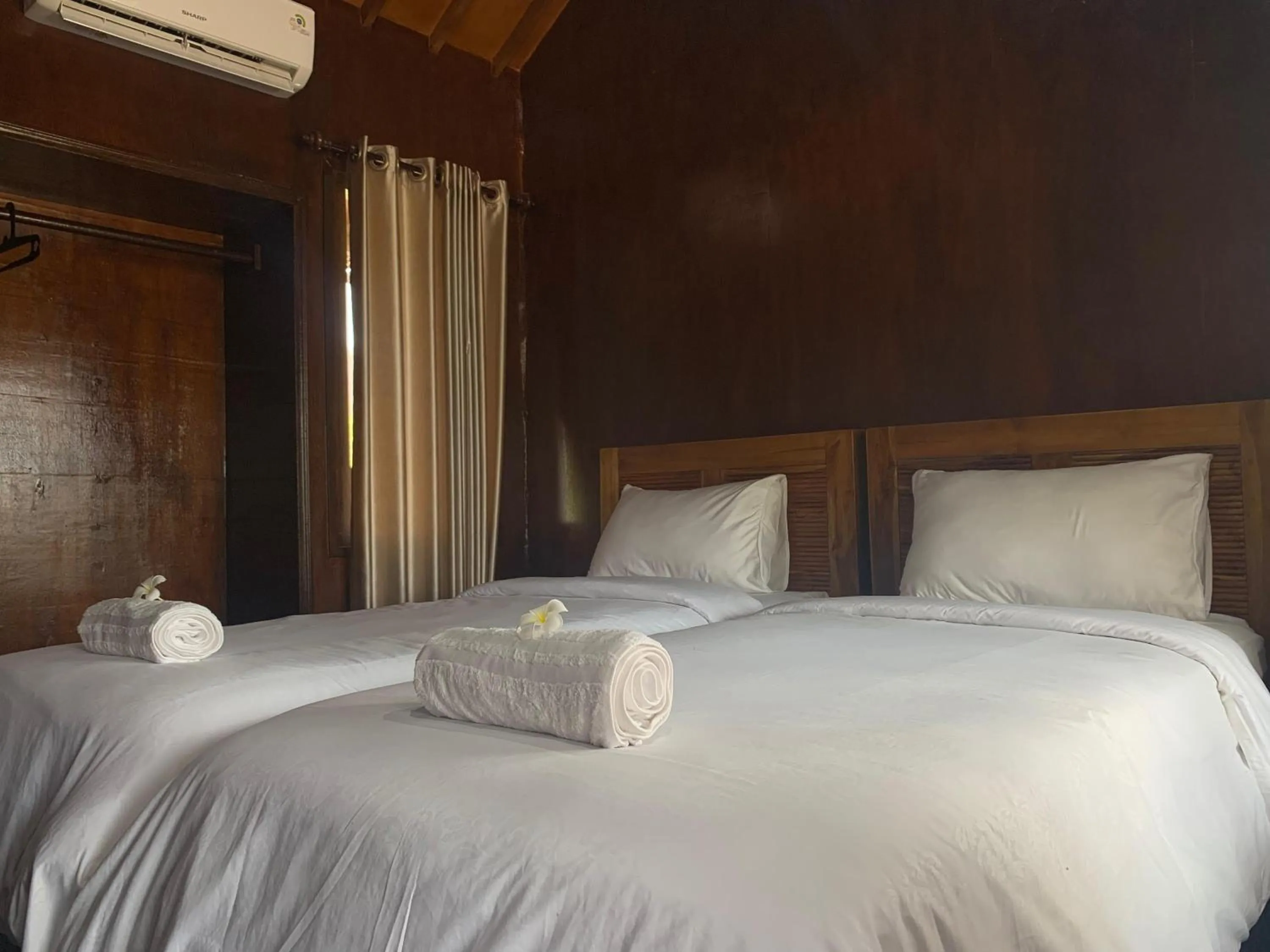 Bed in Q'Pelagos Sunset Bungalow