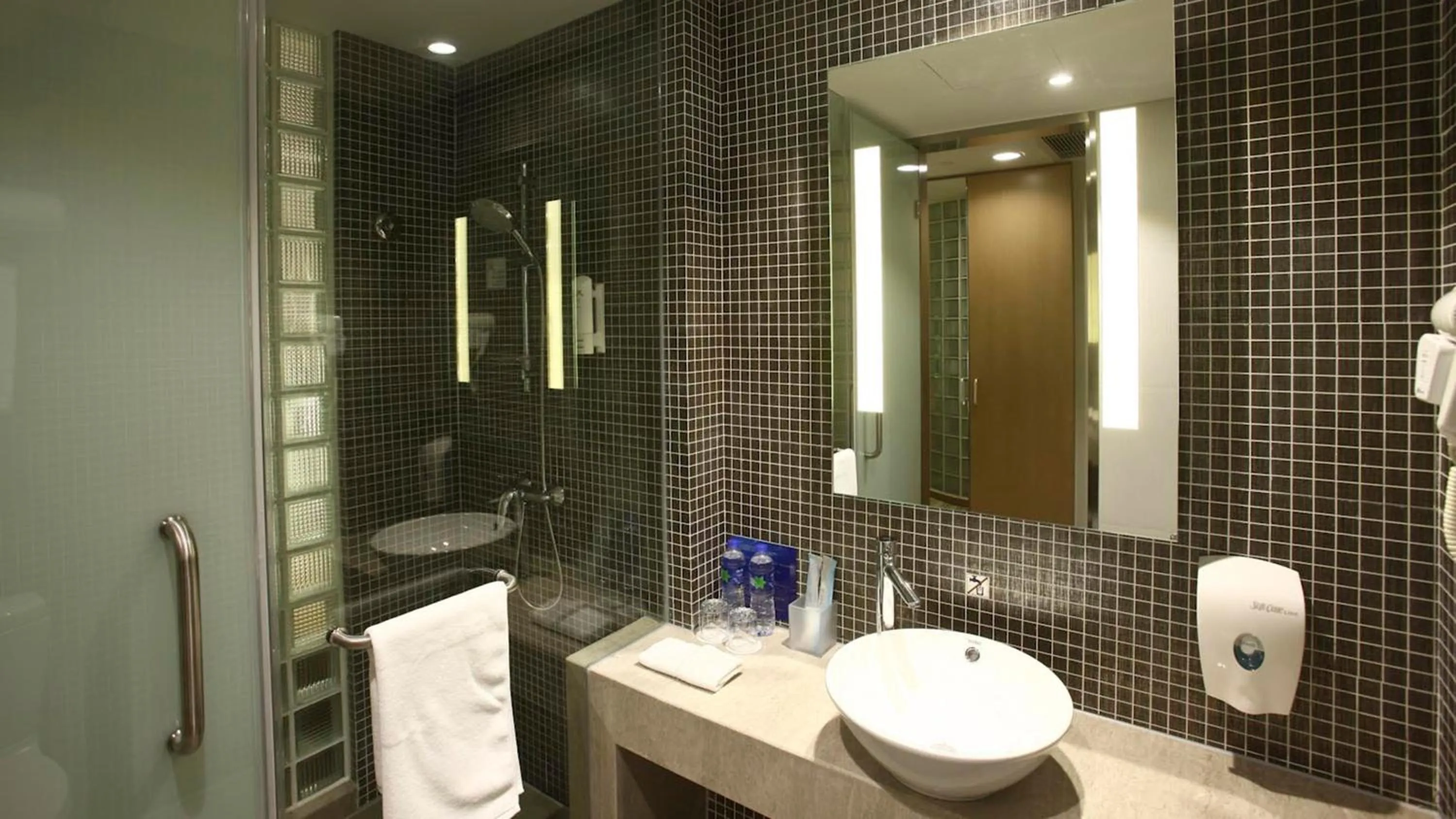 Bathroom in Holiday Inn Express Shanghai Gongkang by IHG