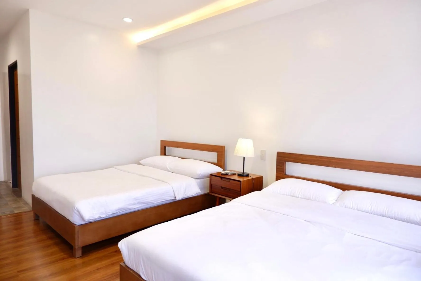 Photo of the whole room, Bed in ECCO Suites Baguio